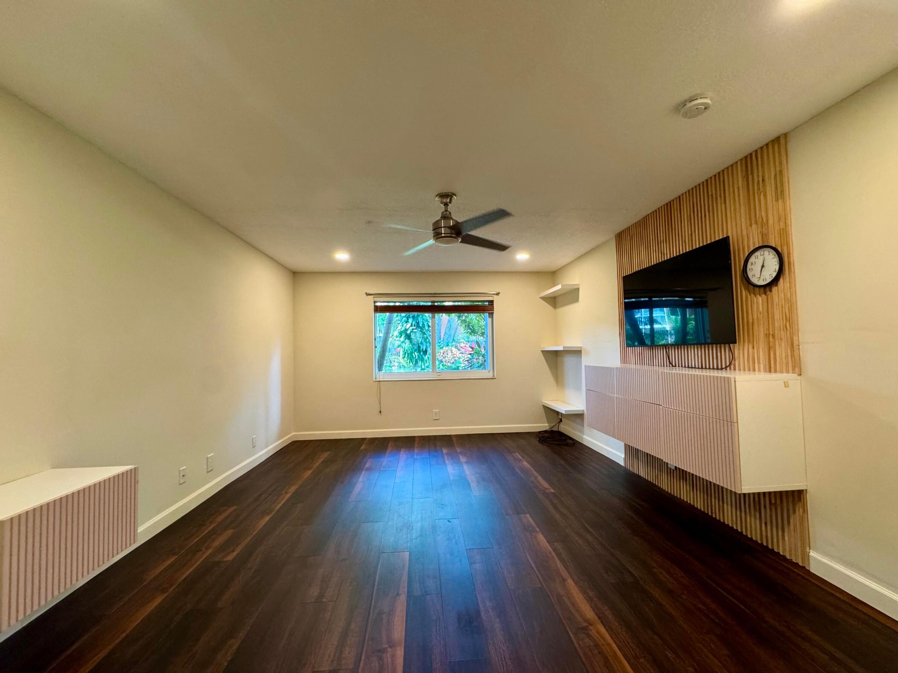 Corner Unit Beauty - Light, Bright & Just Right! Welcome to this spacious 2-bed, 2-bath first-floor corner unit with a beautiful garden view. Enjoy impact windows and doors that fill the home with natural light. It's the BEST PRICED unit with the lowest HOA fees in the entire complex, making it an incredible value! Washer and dryer are allowed, giving you the flexibility to install your own and add convenience. Ideally located just minutes from the beach, major roads, top restaurants, shopping, and vibrant nightlife. The community has been recently updated with fresh paint and new carpets, creating a clean, modern feel. Great opportunity for homeowners or investors—schedule your showing today before it's gone!