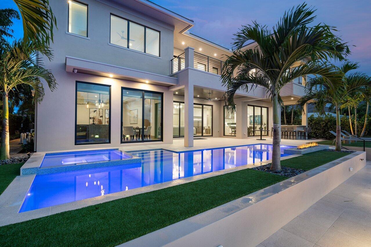 **NEW CONSTRUCTION*WATERFRONT*BUILT BY AWARD WINNING HOMEBUILDER CJM LUXURY HOMES** Nothing else compares to this custom home. This open, modern concept home was built with the highest quality finishes including a concrete second floor system, open riser floating stairs with glass railings, wood flooring throughout, modern ceiling molding details throughout, custom built-in office desk with shelves, separate club room with full bar and custom built-in entertainment unit, separate his and her master bathrooms, master morning bar, elevator, full house generator, Control4 Smart Home including automated window treatments for the club room, lighting control, 4 cameras, music, AC and security included.

Other features include a custom cabinet package, Thermador appliance package with separate refrigerator and freezer, tall wine unit (holds 108 bottles). Club room bar includes ice maker and UC refrigerators. Resort style backyard including heated pool with sun deck, spa and 8' fire feature. Custom built summer kitchen with 36" grill and outdoor refrigerator. New concrete upper and lower dock with Porcelain pavers. Front entry has a water fountain and fire bowl feature, lush landscaping package, and lighting. This beautiful new home has every option for those seeking a top of the line luxury custom living experience. Also includes a full 2/10 Home Buyers Warranty.
