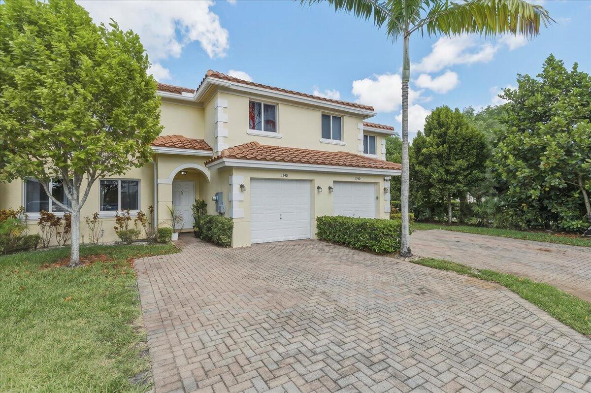 Welcome home to this spacious 3 Bedroom, 2.5 Bathroom Townhome in The Crossings at North Lauderdale. Built in 2019, this townhome offers modern features including Hurricane Impact Windows and Doors and a High Energy Efficient Air Conditioning system. The kitchen and bathrooms feature Shaker Style Cabinets and Granite Countertops, Stainless Steel appliances, and a kitchen island. The first floor boasts 18" x 18" Ceramic tile floors, while the bedrooms are finished with plush carpeting. Additional details include a second-floor laundry room, vinyl shelving in all closets and pantry, Colonist style doors, a 1-car garage with double driveway, and a Spanish 'S' Style Tile Roof with a small rear patio. The low maintenance fee covers roof, exterior maintenance, lawn care, and exterior insurance.