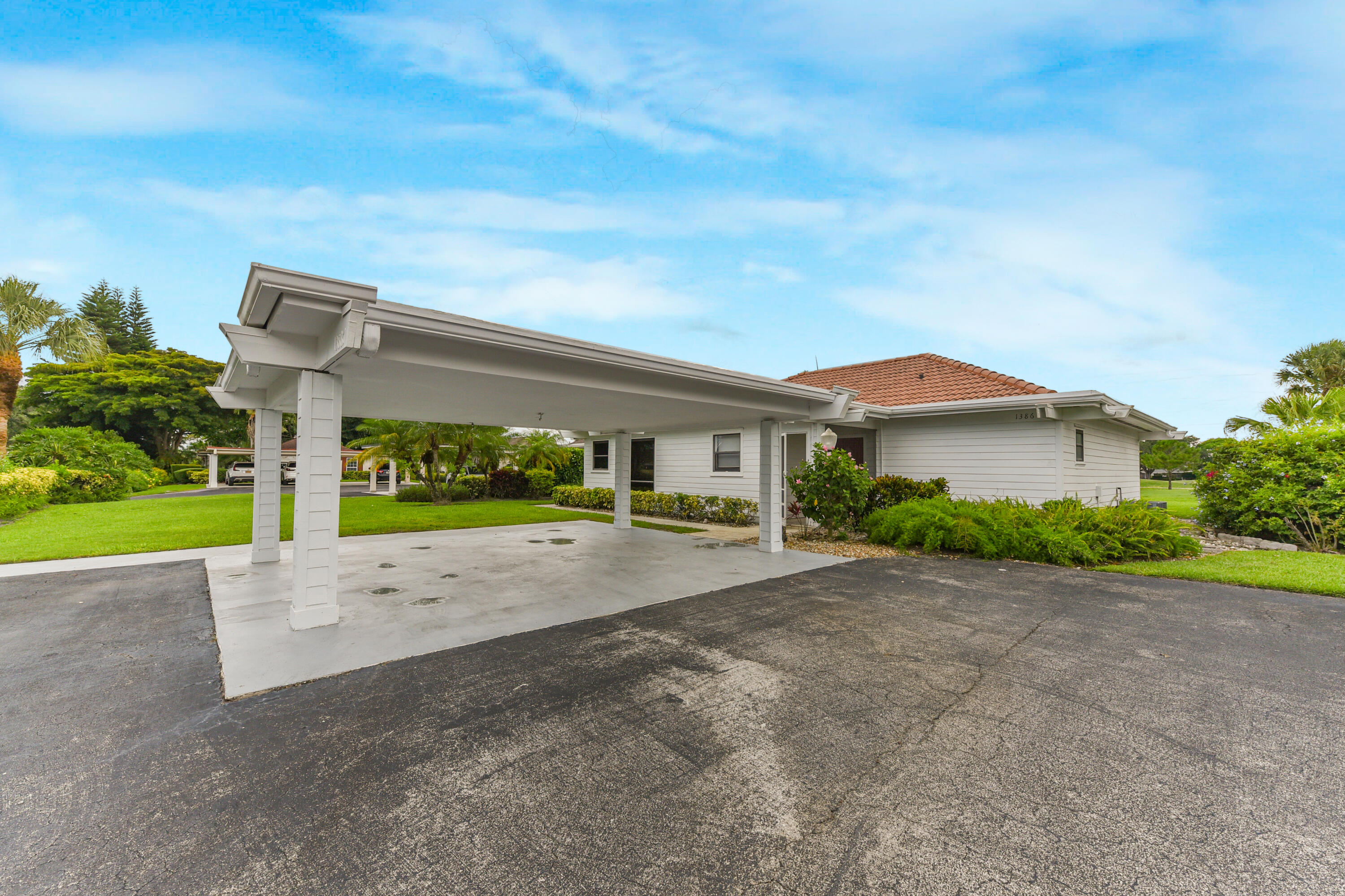 Beautiful 2-bedroom, 2-bath oversized single-family home ideally situated on the golf course. This bright and spacious residence features a desirable split-bedroom floor plan, tile and laminate flooring throughout, and abundant natural light. The generous living spaces offer comfort and flexibility, making it perfect for both everyday living and entertaining. Take in breathtaking golf course views from the expansive Florida room, an ideal space for relaxing, entertaining guests, or enjoying your morning coffee. The home also features an open patio where you can soak up the sunshine and enjoy the peaceful surroundings of this premier golf community. Resort-Style Community Amenities This exceptional property includes a 2-car garage and detached carport, providing enough parking and storage. Residents enjoy access to an outstanding country club lifestyle featuring 36 holes of championship golf, 16 Har-Tru tennis courts, dedicated pickleball courts, a modern fitness center with Pilates studio, daily and weekly fitness classes including yoga and Zumba, resort-style swimming pools, hot tub and lounge areas, and multiple dining venues ranging from elegant fine dining to a casual poolside bistro. This home offers the perfect blend of comfort, recreation, and resort-style living.
