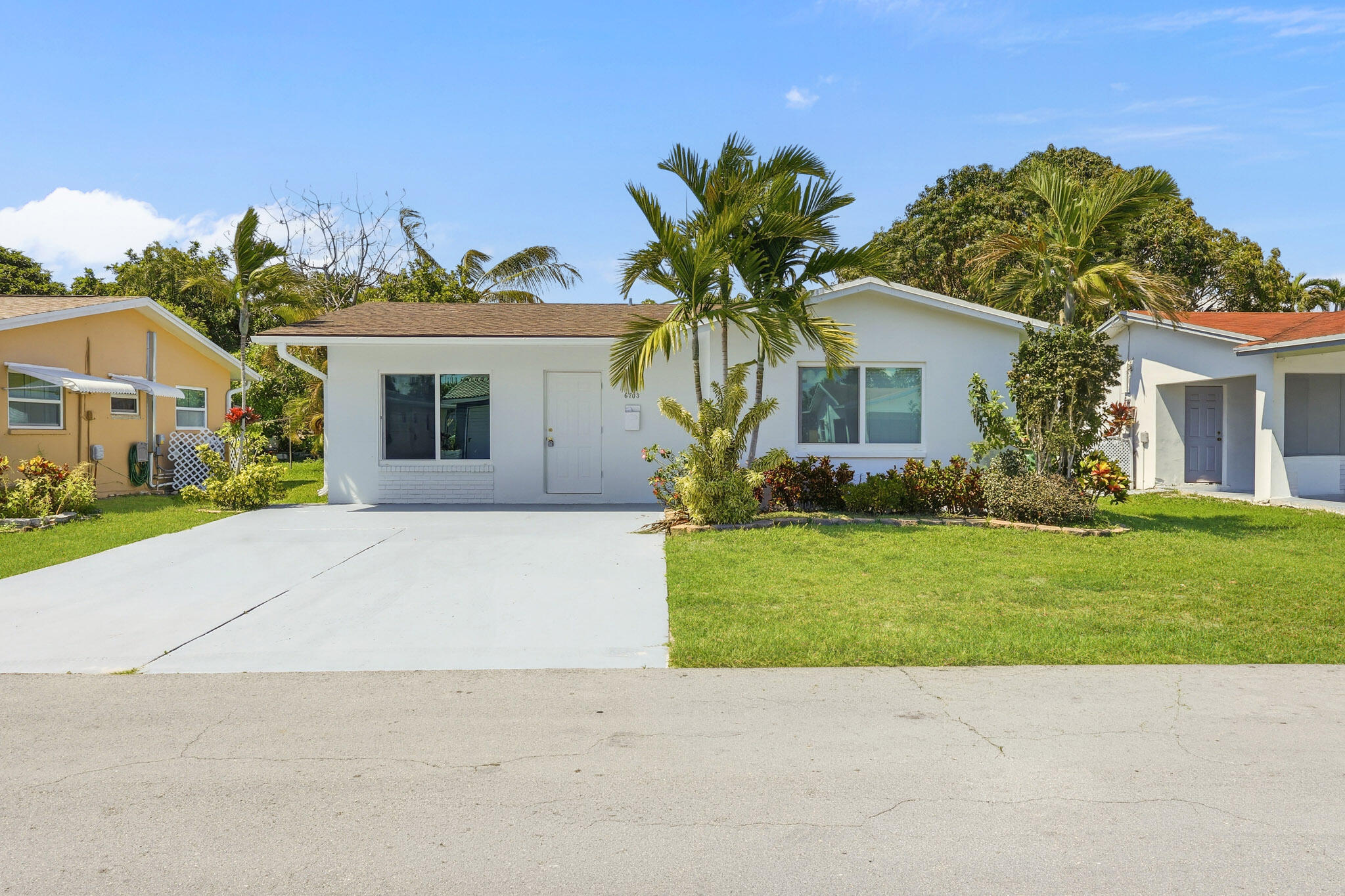 Welcome to this beautifully renovated home in the heart of Tamarac! Roof 2018. All ages community! Hurricane impact windows! Nestled in a private setting at 6703 NW 62nd Street, this charming residence offers modern upgrades, serene surroundings, and access to fantastic community amenities. Step inside to discover stylish tile flooring throughout, creating a clean, cohesive look that's both elegant and easy to maintain. The home features updated bathrooms with contemporary finishes, adding a fresh, move-in-ready feel. Light-filled living spaces provide the perfect backdrop for everyday living and entertaining. Enjoy peace and privacy in your backyard oasis, which backs up to a tranquil canal—no rear neighbors and a relaxing water view make this home truly special. Whether you're sipping your morning coffee or unwinding at sunset, this outdoor space is designed for calm and comfort. Residents also enjoy access to a well-maintained HOA community pool, perfect for cooling off and socializing year-round. Conveniently located near shopping, dining, parks, and major roadways, this home combines modern living with a prime location. Don't miss this opportunity to own a beautifully updated home in a peaceful Tamarac setting!