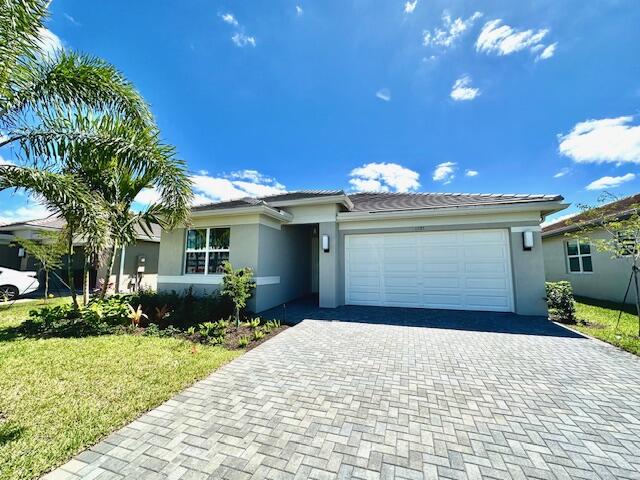 SPACIOUS Sandpiper G/L Model in Valencia Grove. Beautiful Lake View and ALL TILE home waiting for you to move right in. Enjoy the Valencia Resort Lifestyle that has it ALL!