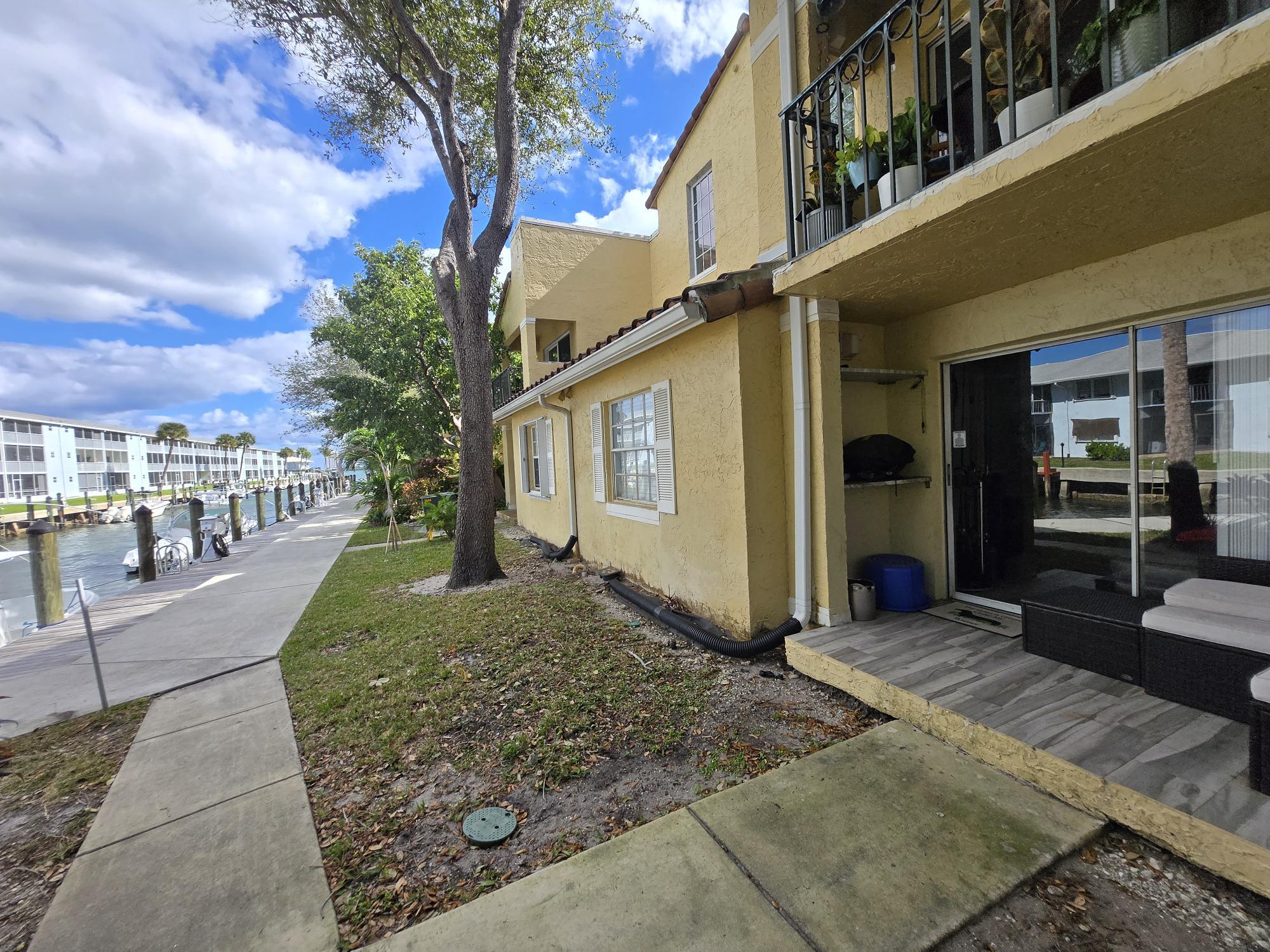 Just Reduced and Priced to sell. Last 1st floor unit on the water. Spectacular view! Totally remodeled a little over 3 years ago; Cabinets, counter tops, Samsung Black Stainless appliances, porcelain plank tiles, modern light fixtures, AC 2 years new, bathroom vanities, bathroom shower tile to ceiling, custom interior doors and moldings. Two deeded parking spaces; One steps from front door and the second one is steps from back porch. Plenty of Guest parking. Currently rented for 2k a month. tenant month to month.
