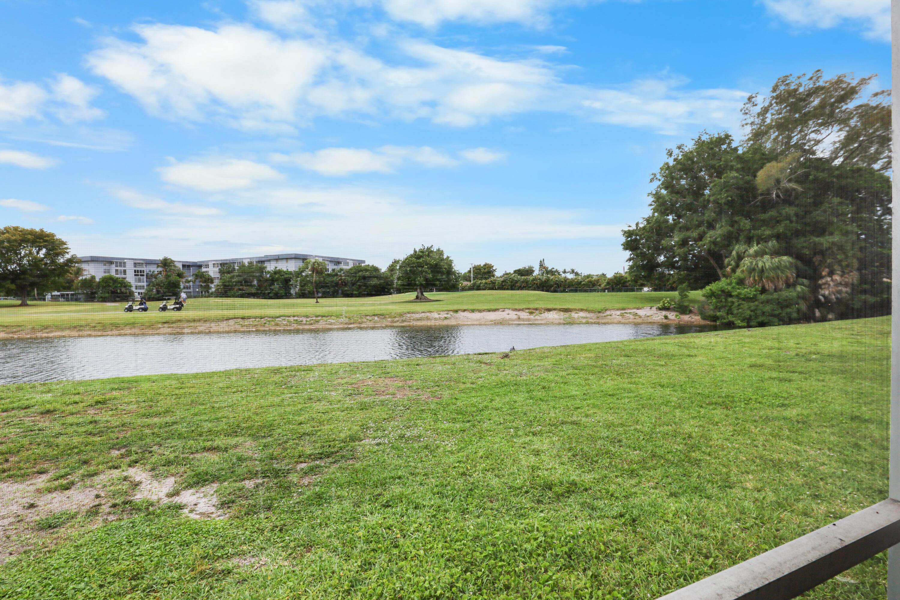 RARE first-floor END unit with peaceful lake views. This 2-bedroom home offers added privacy, abundant natural light, and the convenience of no stairs. Enjoy serene waterfront views along with an in-unit washer and dryer. While the home is ready for updates, the seller is offering a $5,000 CREDIT toward repairs! Creating a great opportunity to customize and add value. A highly desirable combination of first floor living, end-unit positioning, and water views.