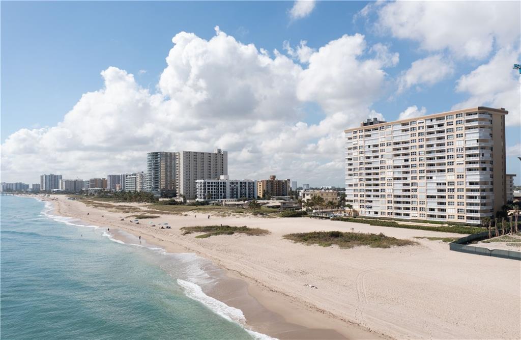 This direct oceanfront unit has been elegantly remodeled in a traditional coastal style that is warm and inviting. The result is a beautiful spacious condo with compelling views of the golden sand beaches and the blue waters of the Atlantic Ocean.  The open kitchen features granite counters with ample space for cooking and entertaining, stainless-steel appliance package. The bathrooms are remodeled and offer refined styling. Washer and Dryer in the unit.  The hurricane impact resistant windows and doors offer protection and security. This 55+ building is conveniently located near shops and restaurants, offers guarded lobby entrance, beachfront pool deck, fitness room, community room, beach side bbq grill and tables. This unit comes with a garage covered parking space. Call today!