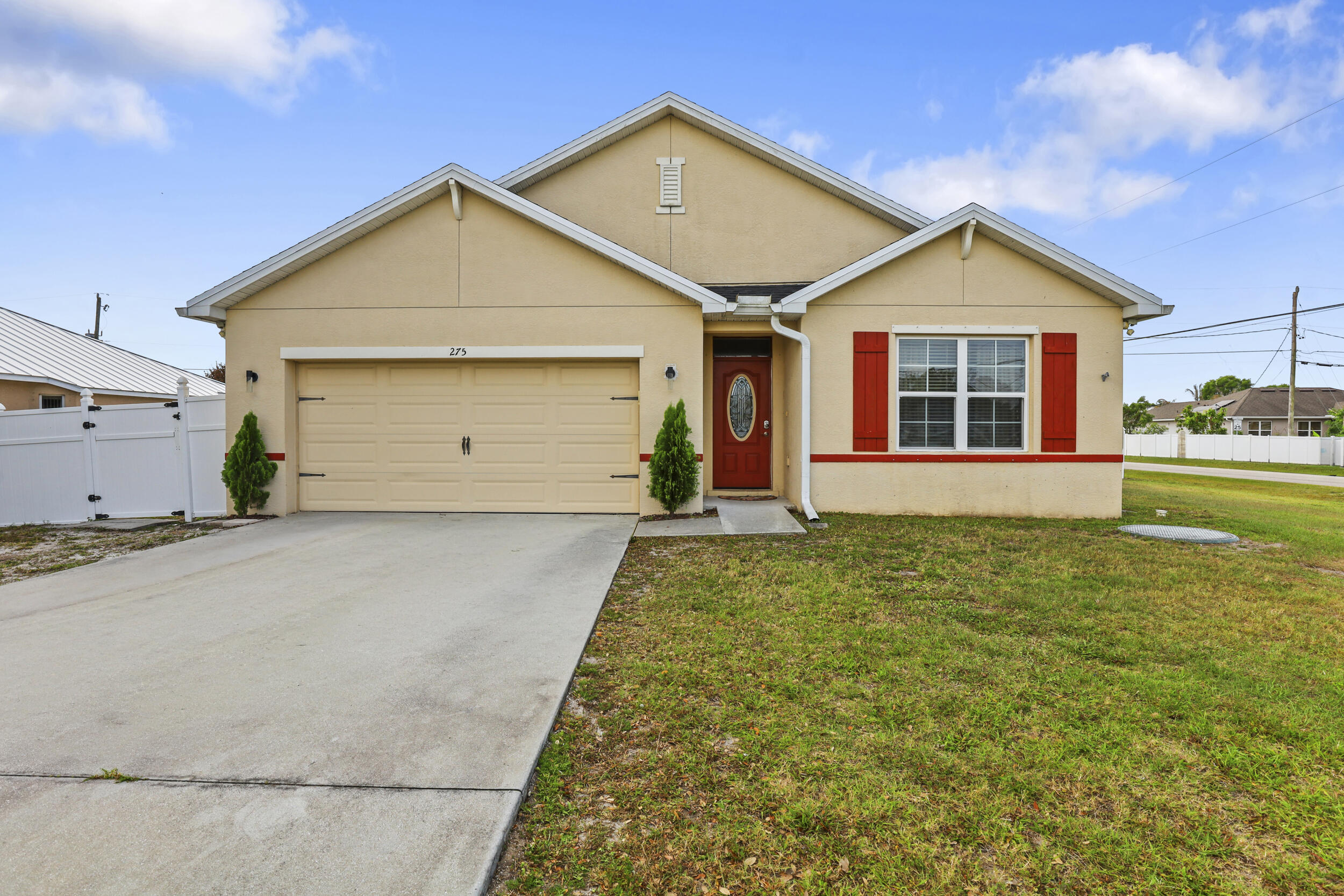 Welcome to 275 SW Tulip Blvd in Port St. Lucie, a 4-bedroom, 2-bathroom, spacious corner-lot home offering the perfect blend of comfort, style, and outdoor entertainment! Step inside and enjoy a bright, open layout enhanced by upgraded light fixtures throughout. The home offers generous living space ideal for both everyday living and hosting guests. Major updates include a brand-new roof (2024), giving you peace of mind for years to come. Outside is where this home truly shines — an amazing fully fenced backyard designed for unforgettable gatherings! Enjoy your private pool, expansive deck, and shed for extra storage. The outdoor space is built for entertaining with a covered outdoor kitchen and a dedicated area to relax and watch your favorite games poolside. Schedule your showing today.