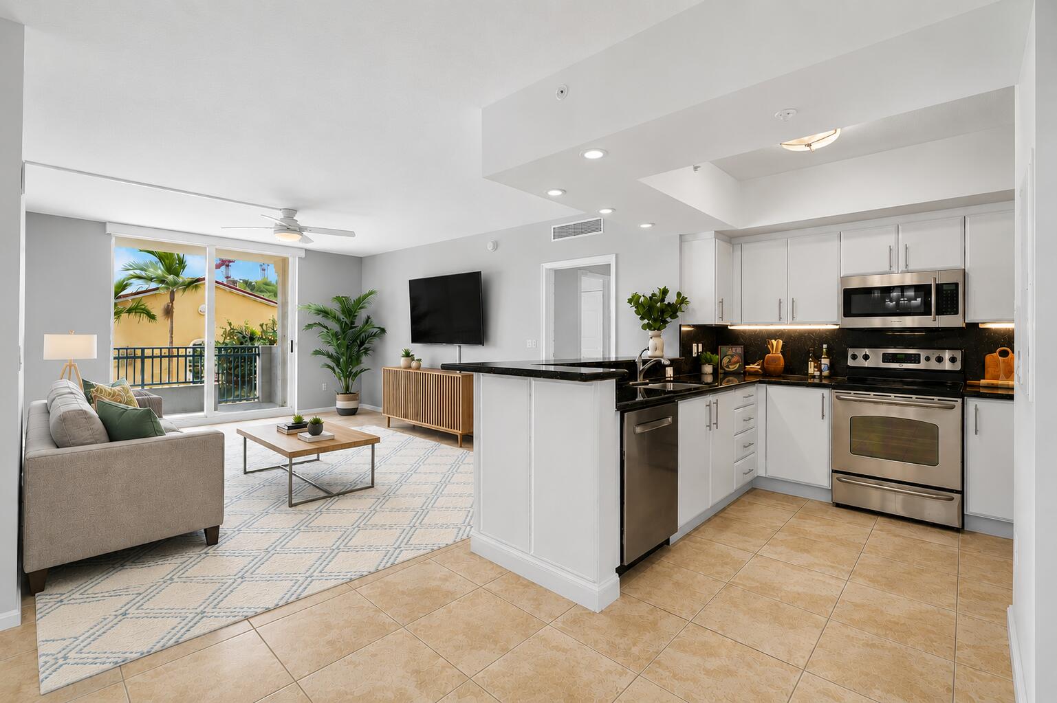 Perfectly positioned in the heart of Downtown West Palm Beach, this beautifully updated 2-bedroom, 2-bath residence offers 1,328 square feet of stylish living in one of the city's most sought-after luxury buildings. Just steps from CityPlace, exceptional dining, boutique shopping, entertainment, the Kravis Center for the Performing Arts, and only minutes to Palm Beach Island, this home places the very best of South Florida right outside your door. Beautifully maintained and tastefully upgraded, the residence combines modern finishes with everyday functionality. The open living spaces feature sleek ceramic tile flooring throughout, creating a clean, contemporary feel with no carpet. The kitchen has been refreshed with bright white refinished cabinetry and newer appliances, while a custom  built-in office provides the perfect work-from-home space. An abundance of professionally designed custom closets maximizes storage throughout the home, and motorized shades in every room, fully integrated with Alexa, bring effortless convenience at the touch of a button. A newer A/C system & updated kitchen appliances completes the home's thoughtful updates.  The private east-facing balcony serves as an extension of the living space, offering beautiful city views and the perfect backdrop for morning coffee, outdoor dining, or relaxing after a day in downtown.  For investors and seasonal owners alike, the building offers immediate rental flexibility with four-month minimum leases permitted up to three times per year. Making this an excellent option for both personal enjoyment and investment potential.  Residents enjoy an exceptional collection of amenities including 24-hour concierge service, a state-of-the-art fitness center, an elegant resident lounge, a peaceful Zen garden courtyard, and a rooftop resort-style pool and spa showcasing breathtaking panoramic views of the city skyline. The building is also nearing completion of an exciting renovation featuring a striking new entrance, redesigned Zen garden, beautifully refreshed exterior with a contemporary new color palette, and an all-new luxury pool deck that will further elevate the resident experience.  With Downtown West Palm Beach undergoing an unprecedented transformation, including luxury hotels, world-class restaurants, Class A office developments, expanded waterfront attractions, and Vanderbilt University's planned campus, the area continues to attract significant investment and national attention. This is an outstanding opportunity to own a luxury residence in one of South Florida's fastest-growing downtowns while values remain exceptionally compelling. Whether you're searching for a full-time home, seasonal escape, or investment property, this residence offers an unbeatable combination of location, lifestyle, and future appreciation.