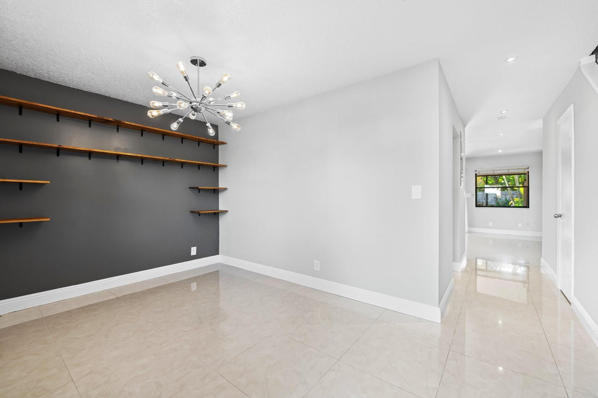 Discover the perfect blend of comfort, style, and convenience in this beautifully upgraded 2-bedroom, 2.5-bathroom fee simple townhome, just steps away from vibrant Wilton Drive. This well-appointed home boasts impact windows and doors, upgraded kitchen and bathrooms with modern finishes, and sleek tile flooring throughout. Both spacious master bedrooms offer private baths and generous closet space. Enjoy the screened-in patio, or entertain friends and family in the oversized fenced yard, offering both privacy and space for gatherings. Nestled in a well-maintained, pet-friendly community at the quiet end of the street, this home offers a large driveway accommodating up to four cars. Located just two blocks from Wilton Drive, you'll love the easy walk to dining, shopping, and entertainment.