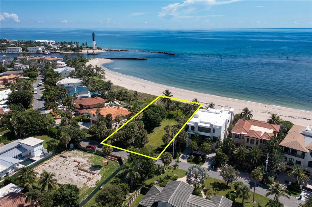 BACK ON THE MARKET! RARE VACANT OCEANFRONT LAND!! An extraordinary opportunity to secure one of the last vacant oceanfront parcels in South Florida. Permitting is near the final stages, offering a rare opportunity to build a custom coastal estate while making select design choices before plans are completed. Enjoy unobstructed ocean views and sightlines to the iconic Hillsboro Lighthouse in a truly irreplaceable setting. Located in the exclusive enclave of Hillsboro Shores, a private beachfront community known for direct beach access, limited inventory, and a serene island-like atmosphere. Positioned amid Pompano Beach’s luxury renaissance with nearby Waldorf Astoria, Ritz-Carlton, and Armani/Casa developments enhancing long-term value and lifestyle appeal.