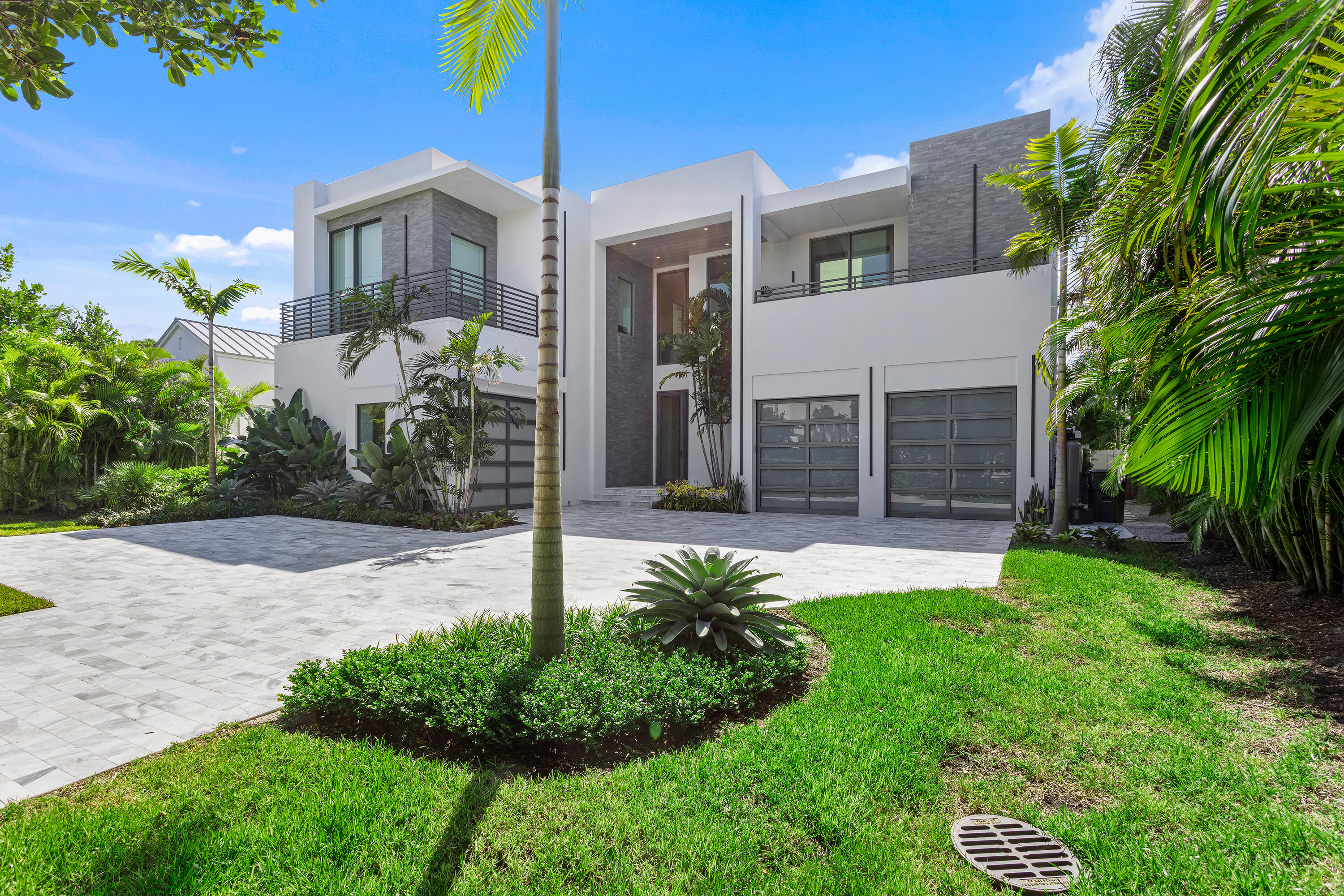This brand-new five-bedroom Modern-style estate, built in 2022 by Signature Builders Group, is close to the beach and on the waterfront with a dock in Delray Beach's prestigious Estate Section. Three chic living areas, all opening to the pool- and water-view covered loggia, invite indoor/outdoor entertaining, and the primary suite and a guest suite open to private water-view balconies. LOCATION: 

1260 South Ocean Boulevard, Delray Beach, Florida: The sought-after Estate Section in Delray Beach is just steps from the City's pristine award-winning beaches. This premier neighborhood is also just a short drive to Downtown Delray Beach's vibrant Atlantic Avenue, with its array of arts and entertainment offerings interspersed with fine-dining establishments, cafés and bars.

PROPERTY: 

The tropically landscaped gated front yard, with a gray brick drive, presents beautifully, while the back yard features a wonderful entertainment area. The large covered loggia, with automatic screens, features a summer kitchen overlooking the salt-water heated pool and spill-over spa, and a grilling station is on a side loggia. At the end of the canal with 40-feet of waterfrontage, the composite dock can accommodate a boat up to 30 feet. With two garages, one accommodates two cars, and the other garage currently serves as an air-conditioned gym. 

RESIDENCE:  

Built in 2022 by Signature Builders Group, this five-bedroom, 8,580 +/- total-square-foot Modern-style masterpiece features a dramatic open design with walls of floor-to-ceiling impact-glass that bathe the interiors in soft natural light and offer serene water views. Chic details include cerused wide-plank wood floors, custom cabinetry, designer light fixtures, and attractive three-dimensional feature walls. The foyer and stair hall flow out to the great room, with living and dining areas fronted by a bank of sliding doors that open to the pool loggia offering water views. Flanking the great room is the club room, featuring pocket sliding doors accessing the pool loggia, a fully equipped underlit marble-topped wet bar, and a handsome feature wall behind the television. On the other side of the great room is the family room, with an entire corner of glass sliding doors that open to the pool loggia inviting indoor/outdoor entertaining. Just adjacent, the gourmet kitchen is finished with custom cabinetry, marble counters, pantry, professional-grade appliances, and a center cook island with an attached table. On the second floor, a loft living area serves the primary suite, his and her offices, and three guest bedrooms. The water-view primary suite comprises a spacious bedroom opening to a large private balcony, custom-fitted walk-in closets, and a spa-inspired tiled bathroom with an underlit double-sink vanity, walk-through shower, freestanding tub, and separate water closet. His office, with  custom cabinetry, features floor-to-ceiling windows that also offer incredible water views. The guest bedrooms have ensuite bathrooms and private balconies. Completing the layout are an elevator, first-floor guest bedroom suite, second floor laundry room, and a powder room. Amenities include automatic blinds, natural gas accommodation, full-house generator, four American Standard air conditioners, a tankless hot-water heater, LED lighting, and full-house water purifying system.

The information herein is deemed reliable and subject to errors, omissions or changes without notice.  The information has been derived from architectural plans or county records. Buyer should verify all measurements. 

DISCLAIMER: Information published or otherwise provided by the listing company and its representatives including but not limited to prices, measurements, square footages, lot sizes, calculations, statistics, and videos are deemed reliable but are not guaranteed and are subject to errors, omissions or changes without notice. All such information should be independently verified by any prospective purchaser or seller. Parties should perform their own due diligence to verify such information prior to a sale or listing. Listing company expressly disclaims any warranty or representation regarding such information. Prices published are either list price, sold price, and/or last asking price. The listing company participates in the Multiple Listing Service and IDX. The properties published as listed and sold are not necessarily exclusive to listing company and may be listed or have sold with other members of the Multiple Listing Service. Transactions where listing company represented both buyers and sellers are calculated as two sales. The listing company's marketplace is all of the following: Vero Beach, Town of Orchid, Indian River Shores, Town of Palm Beach, West Palm Beach, Manalapan Beach, Point Manalapan, Hypoluxo Island, Ocean Ridge, Gulf Stream, Delray Beach, Highland Beach, Boca Raton, East Deerfield Beach, Hillsboro Beach, Hillsboro Shores, East Pompano Beach, Lighthouse Point, Sea Ranch Lakes and Fort Lauderdale. Cooperating brokers are advised that in the event of a Buyer default, no financial fee will be paid to a cooperating Broker on the Deposits retained by the Seller. No financial fees will be paid to any cooperating broker until title passes or upon actual commencement of a lease. Some affiliations may not be applicable to certain geographic areas. If your property is currently listed with another broker, please disregard any solicitation for services. Copyright 2022 by the listing company. All Rights Reserved.