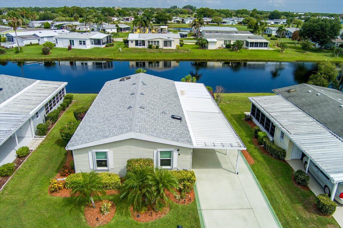 Welcome to this charming 3-bedroom, 2-bathroom home nestled on cul-de-sac in Savanna Club. This waterfront property provides a unique opportunity to enjoy peaceful aquatic surroundings. The thoughtful layout includes three generously proportioned bedrooms and two full bathrooms. Roof is approximately 3 years old. AC with new ductwork, and water heater were replaced in 2019. Accordion Shutters, impact windows in the kitchen nook. Dual paned windows throughout. Extended/newer shed. Separately AC'd enclosed lanai and fenced in patio overlooking the water. Recently painted wide driveway.