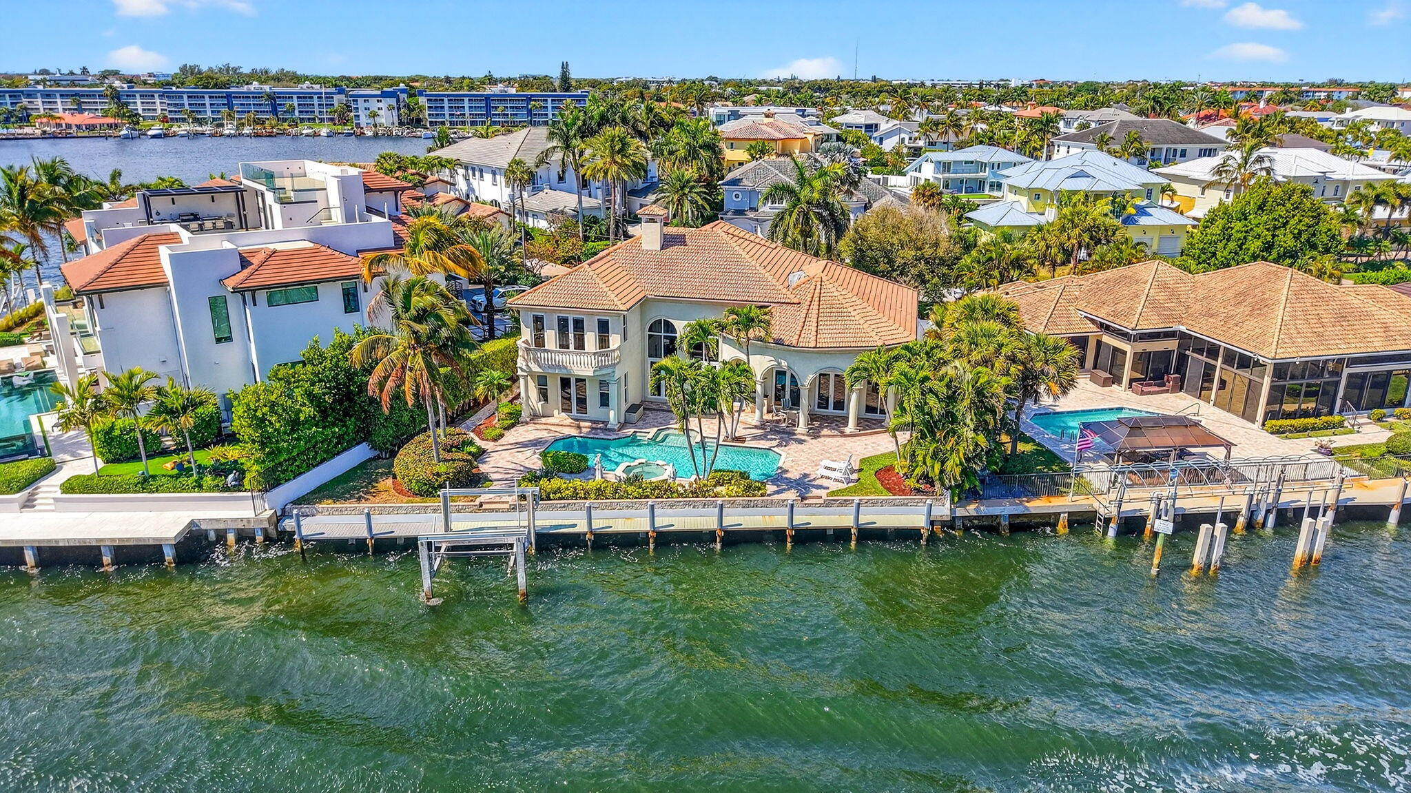 Experience refined waterfront living in this beautifully updated and meticulously maintained direct Intracoastal estate in the prestigious Tropic Isle community of Delray Beach. Offering approximately 100± feet of direct Intracoastal frontage, this exceptional residence is a true boater's paradise.  Set on a cul- de-sac, a beautiful brick-paver driveway leads to a grand columned entrance. The backyard is designed for effortless entertaining, featuring a covered patio, resort-style pool with spillover spa, and sweeping water views as the backdrop. Designer finishes throughout include Saturnia marble flooring, detailed millwork, new brass hardware and coach lamps. Additional amenities include a full-house Generac generator (with 5-year warranty), central vacuum system, propane gas tank, new diamond brite in pool, new 75 gallon hot water heater, and a seawall that is serviced and maintained annually. Located in Tropic Isle, a sought-after yachting community fronting the Intracoastal Waterway with deep-draft canals and yacht harbor, this property is just minutes from Atlantic Dunes Park and vibrant Atlantic Avenue, known for its premier shopping, dining, and entertainment.