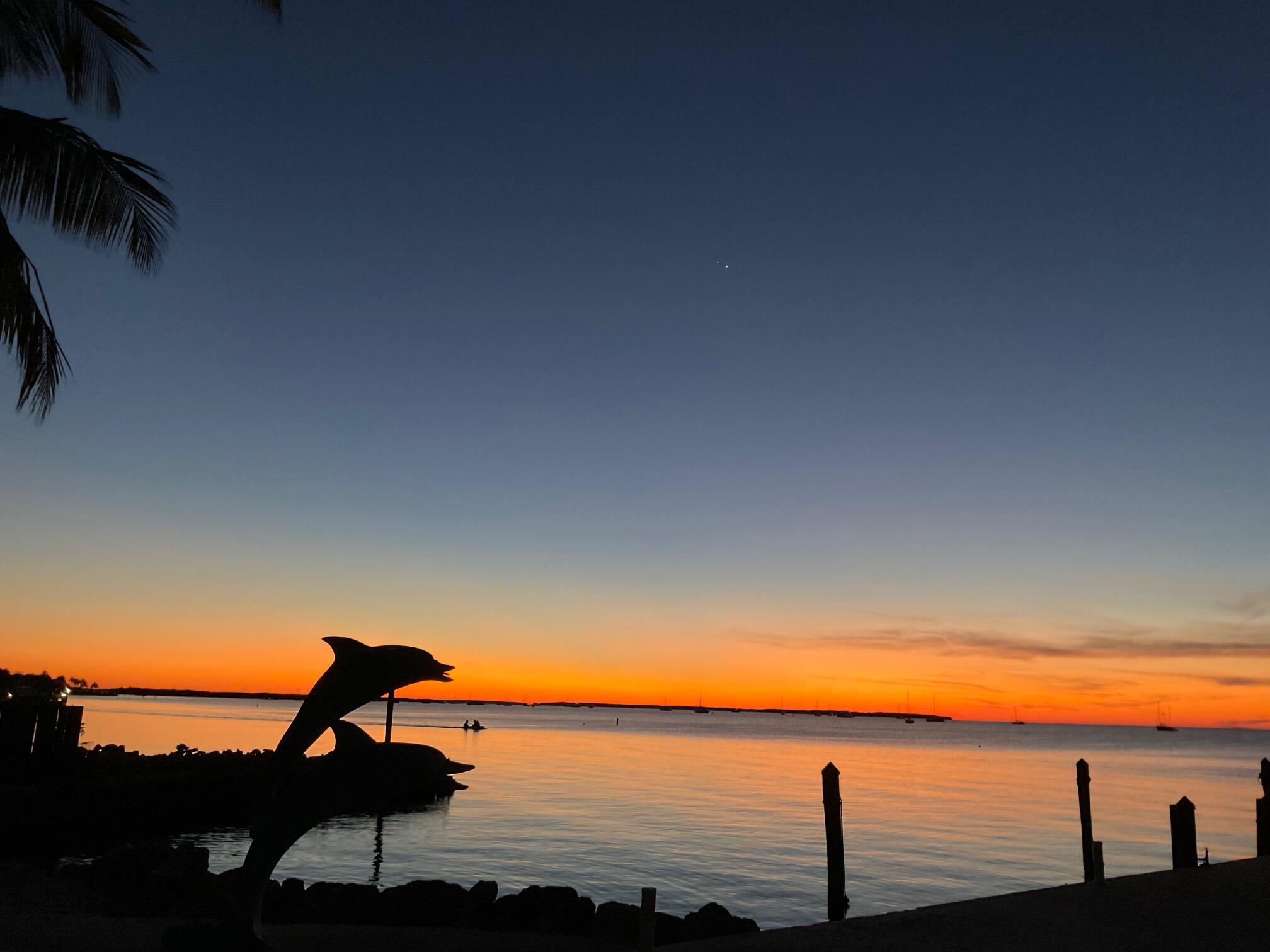 Welcome to Paradise!  Love the Keys, this is the perfect spot to decompress.  Take in the breathtaking sunset views of the Gulf with almost 200 feet of frontage.  Lots to do outside, plenty of dock space,.  Take your Kayak or small boats to launch down the boat ramp.
Inside are 2 King size bedroom suites upstairs, with a full kitchen, dining area, living room and TV area.  Amazing views from your upstairs outside screened balcony.  
Plenty of sleeping area downstairs with a kitchenette, laundry area for both upstairs and down along with a living/dining room.  Downstairs screened patio has a huge table for everyone to enjoy.  Don't miss this gem!