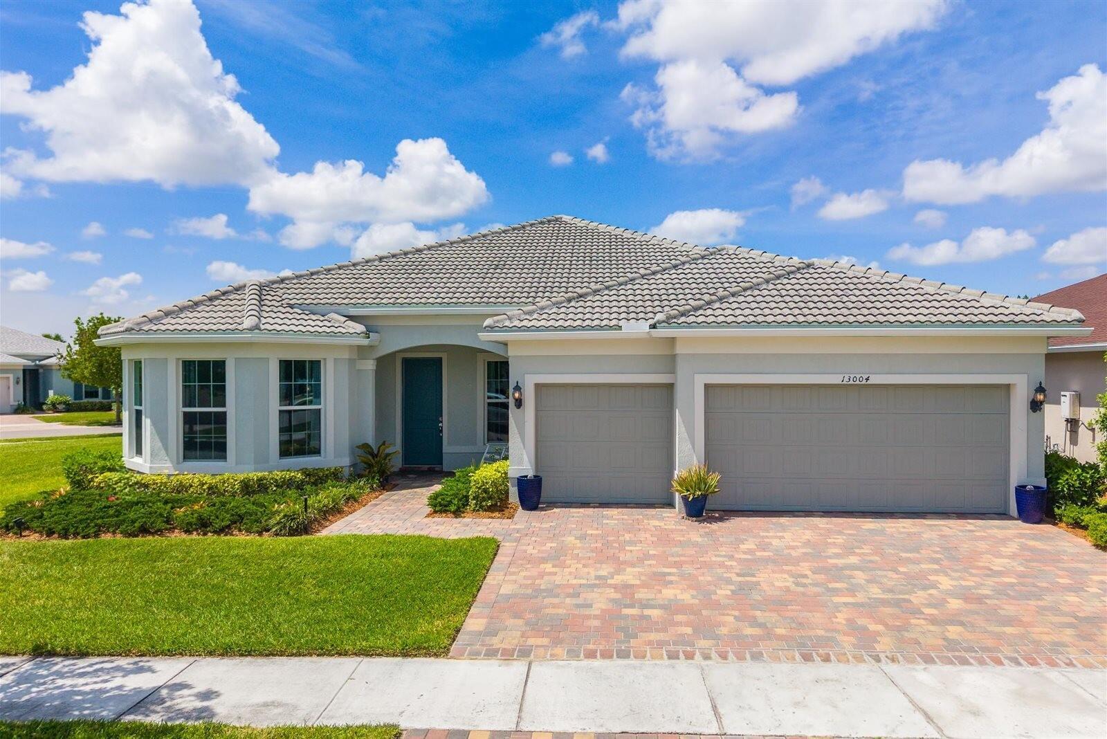 Must-see home in the highly sought-after Del Webb community at Traditions in Port St. Lucie! This immaculate 3-bedroom, 3-bath residence with a den features the popular Pinnacle floor plan and is situated on an expansive corner lot, backing up to a manicured common area.  Step inside to discover a truly exceptional gourmet chef's kitchen. Designed to impress, it features a 5-burner gas stove, 42" upper cabinets with crown molding, under-cabinet lighting, a fully built-out pantry, and upgraded soft-close cabinetry with convenient pull-out storage. Beautiful quartz countertops and an oversized island make this kitchen as functional as it is stunning--for both everyday living and entertaining. The kitchen flows seamlessly into a spacious living area, where a zero-corner sl iding glass door creates a true indoor-outdoor living experience, opening to a screened lanai for relaxing or hosting guests.  The home features upgraded tile flooring throughout and high-end finishes designed for both comfort and style. The spacious primary suite features a massive walk-in closet with custom built-ins and a beautifully upgraded bathroom featuring an oversized walk-in shower.  The guest bedroom is enhanced with a charming bay window and a private en-suite bathroom with an upgraded shower--for visitors seeking comfort and privacy. Additional highlights include three linen closets with added shelving, generous walk-in closets in every bedroom, a fully finished laundry room with a sink, impact windows throughout, and whole-home fiber optic internet for fast, reliable connectivity.  Living in Del Webb at Traditions is a paradise. Residents enjoy two clubhouses and two resort-style pools with lap lanes, along with a putting green, pickleball and bocce ball courts, a dog park, and a scenic fire pit overlooking the lake. A state-of-the-art fitness center and a vibrant calendar of social clubs and activities create a true sense of community with something for everyone.