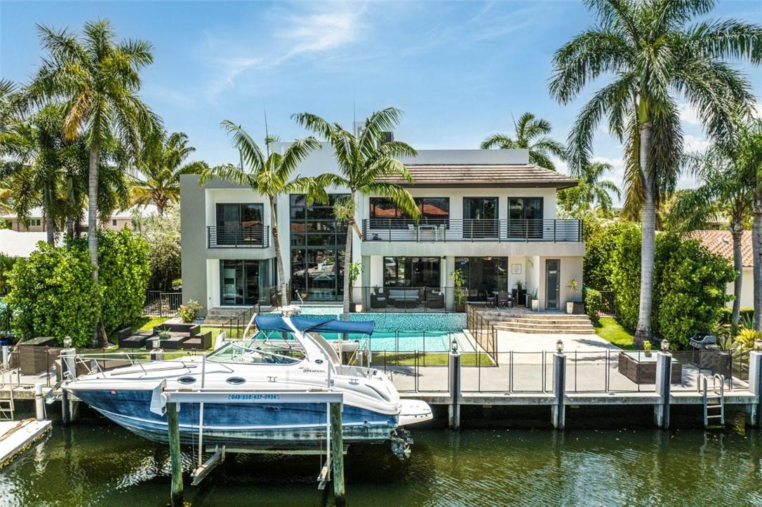 This stunning, contemporary, custom built home boasts 6 bedrooms, 5 bathrooms, positioned just 3 homes East from the Intracoastal Waterway, with Northern exposure on 80 feet of waterfront.  Modern, gourmet eat-in kitchen with custom Italian glass doors, quartz counters, Subzero and Wolf, built-in espresso maker, natural lighting with views of the pool, covered porch and waterway.  Polished concrete floors, high ceilings, open floor plan, heated pool, concrete dock, striking tall windows welcoming natural lighting to comfort you the moment you walk in, concrete stairs,  2 bedrooms downstairs, and 4 bedrooms with private balconies upstairs...too many features to list.  Come see for yourself and move to your dream home. Home needs work and loved once again!
