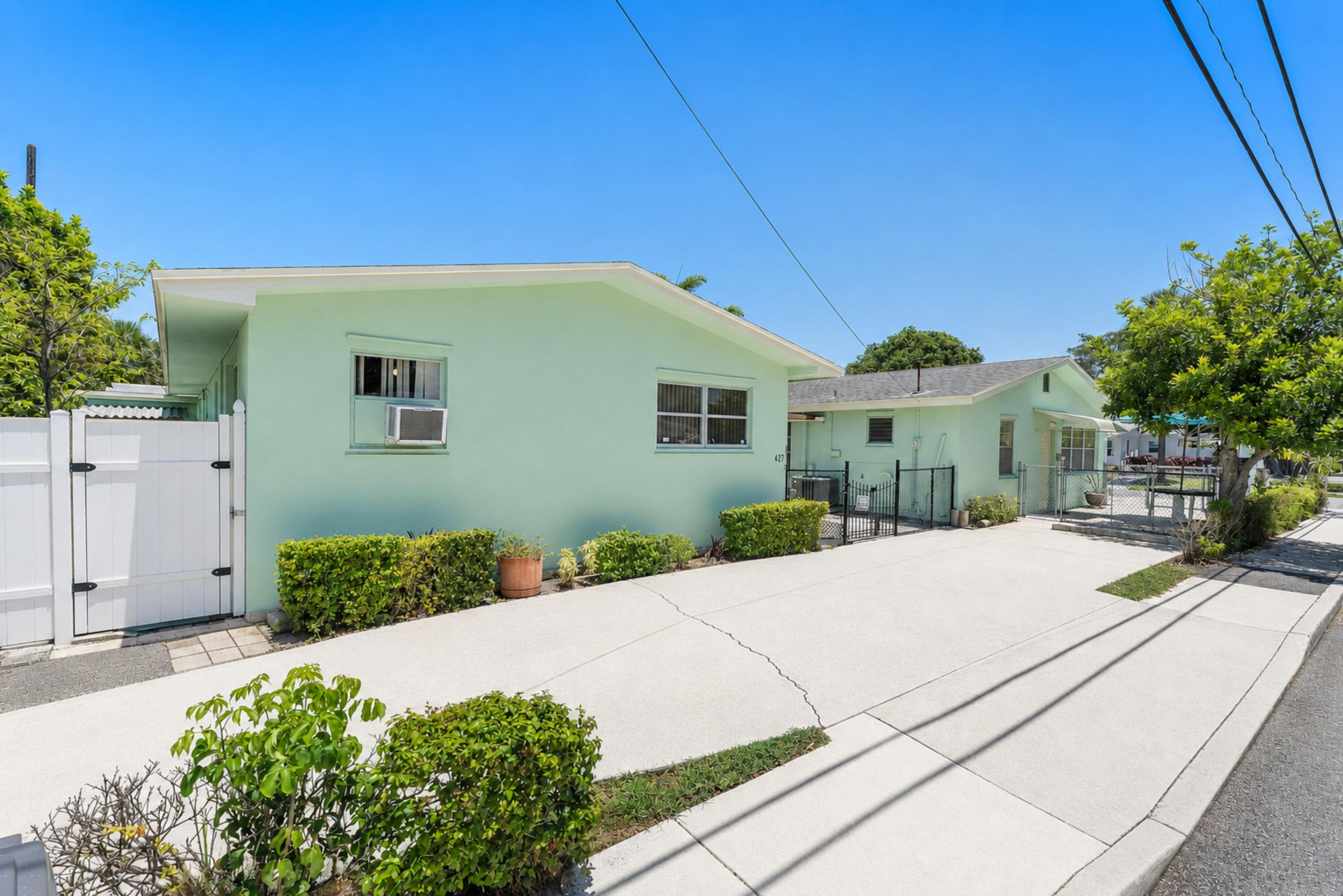 Rare triplex offering in the heart of SoSo, one of West Palm Beach's fastest-appreciating neighborhoods, just minutes from Downtown WPB, Flagler Drive, the Intracoastal, and the booming financial corridor drawing new firms and residents to the area. Two separate buildings on one lot: Building 1 features a spacious 2BR/2.5BA home, ideal for an owner-occupant or rental. Building 2 offers two individual 1BR/1BA units, each with separate water and electric meters, perfect for additional rental income, seasonal rentals, and Airbnb. Live in one unit and let the other two cover your mortgage, or hold all three as a turnkey rental portfolio. With SoSo's continued transformation and proximity to WPB's growing downtown core, this property offers both immediate income and long-term upsi.de