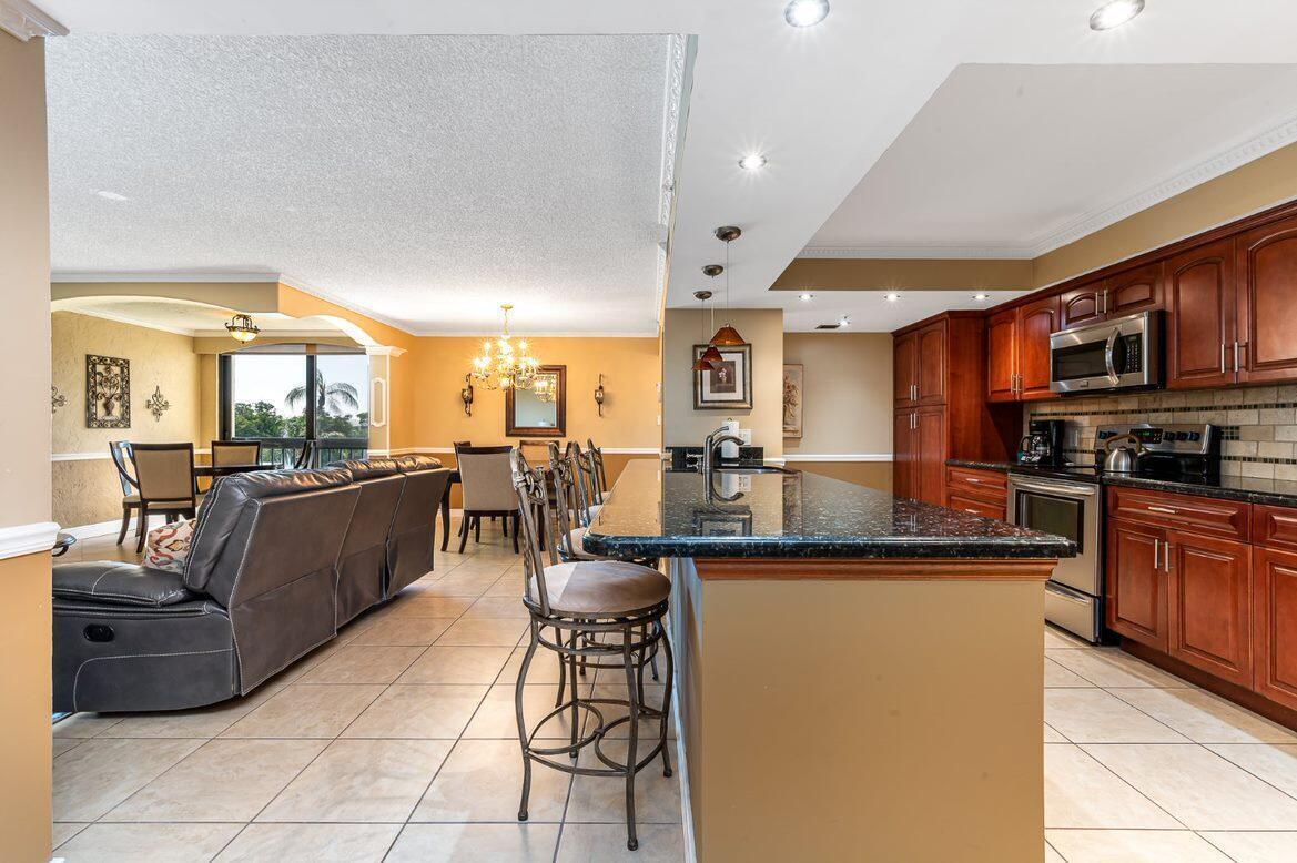 Beautifully updated 2 Bed and 2 Bath waterfront condo in the great community of Lakeside. Light and bright open floor plan, split bedroom and great views of the lake and pool. Renovated kitchen and baths, newer appliances, beautiful fixtures, custom wood cabinets, granite counter tops. All newer furniture. Washer and Dryer in the unit. Beautiful view of the pool and lake. Ideally located about 1 mile to Delray's finest beaches. I-95, Fl Turnpike and renowned Atlantic Blvd. You can drive or bike to fine dining, shopping and walk to the new Wholefood.