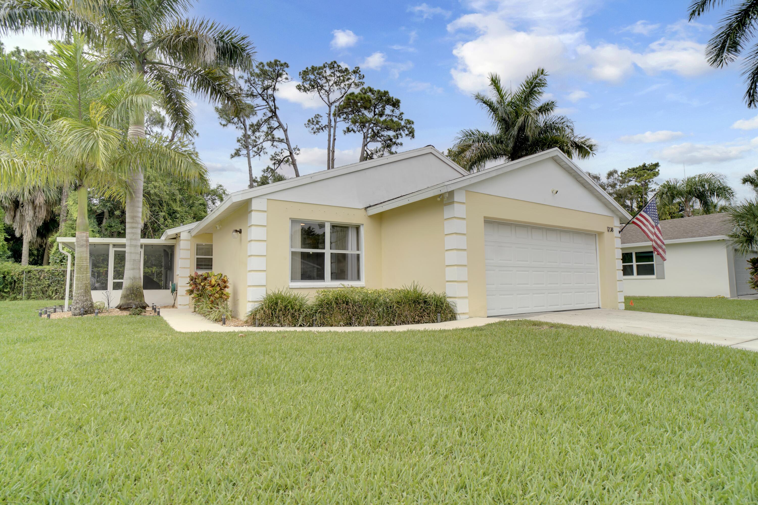 This stunning, fully renovated 2-bed, 2-bath single-family home in Palm Club Village checks every box — soaring vaulted ceilings, an open-concept layout with a dramatic reclaimed wood accent wall, new flooring, renovated kitchen with white shaker cabinets, granite countertops, stainless steel appliances, and an oversized island, plus a spa-like primary en-suite with a frameless glass walk-in shower. All of this just minutes from Palm Beach International Airport, Tanger Outlets, Kravis Center, Clematis Street, Rosemary Square, top-rated schools, and the beaches of Palm Beach with quick I-95 access. Homes like this don't last — schedule your showing today before someone else calls it home.
