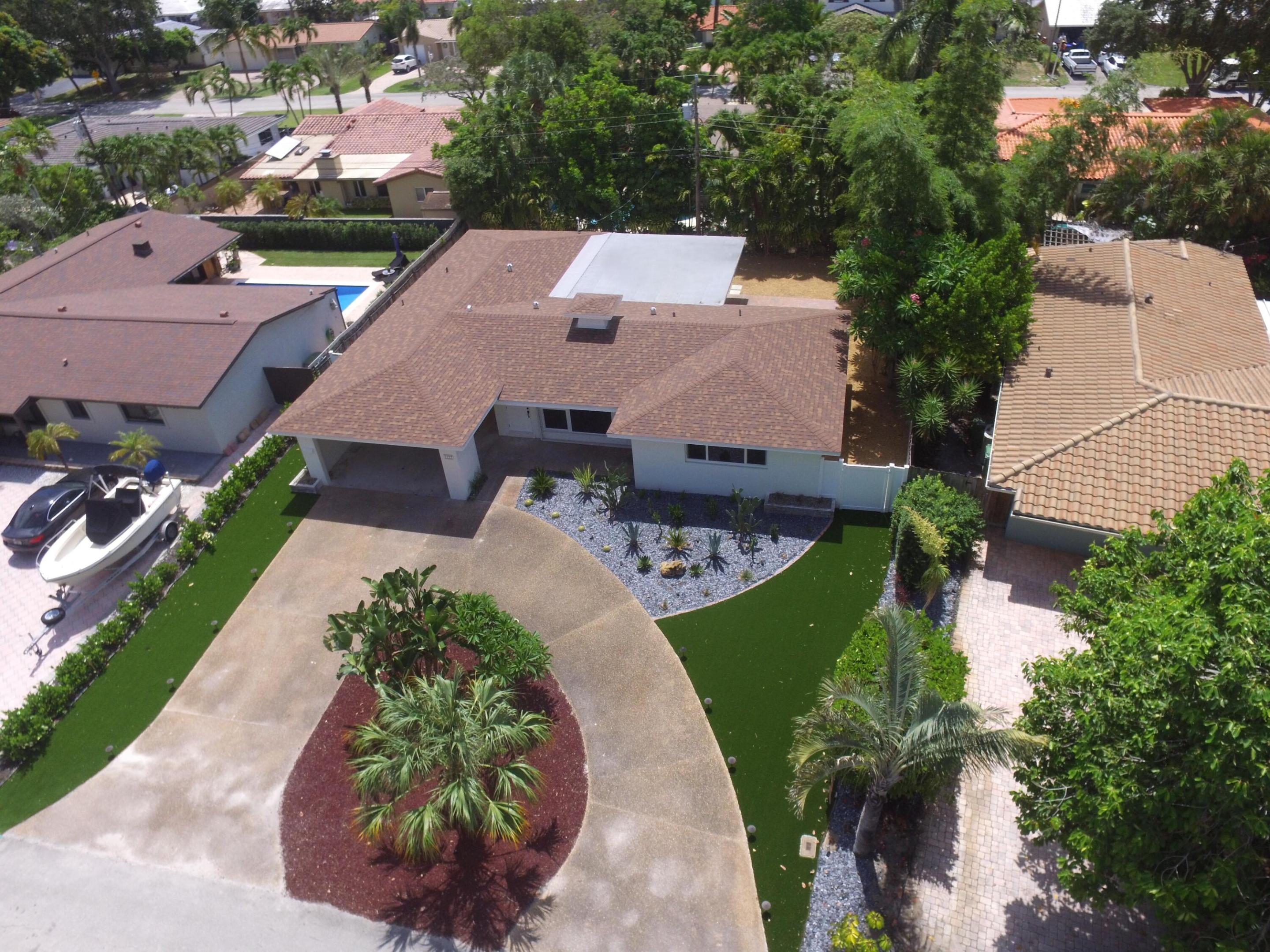 Welcome to this charming single-story home in the highly sought-after Coral Ridge neighborhood of Fort Lauderdale. Designed for comfortable South Florida living, this residence features a spacious interior, three bedrooms, two full bathrooms, and a functional open floor plan ideal for both everyday living and entertaining. Enjoy the expansive screened-in lanai, offering the perfect space to relax, dine, or host guests while overlooking the backyard. The seamless single-level layout creates a bright and inviting atmosphere throughout. Ideally situated just minutes from Pine Crest School, Holy Cross Hospital, premier shopping, dining, and everyday conveniences, this home is also less than two miles from Fort Lauderdale's beautiful beaches.  Don't miss this exceptional opportunity to own a home in one of Fort Lauderdale's most desirable neighborhoods. Some of the photos show the property virtually staged.