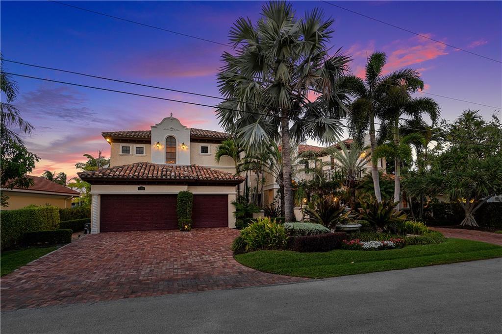 Spectacular Custom Waterfront estate home with a gated courtyard entry, grand foyer that opens up to 25' high living room. There is 100 feet of unrestricted waterfront with an infinity pool overlooking a 110' wide canal. Expansive water views of the wide canal from almost every room! Enjoy panoramic views of the waterway from the oversized balconies, a luxury heated pool with a large sun shelf and a jetted spa, huge outdoor kitchen with dining area and plenty of room for lounging. Relax and have a move night at home in the home theater with booming surround sound. Master bathroom has large whirlpool spa, separate shower and dual vanities. His & Hers walk-in closets!