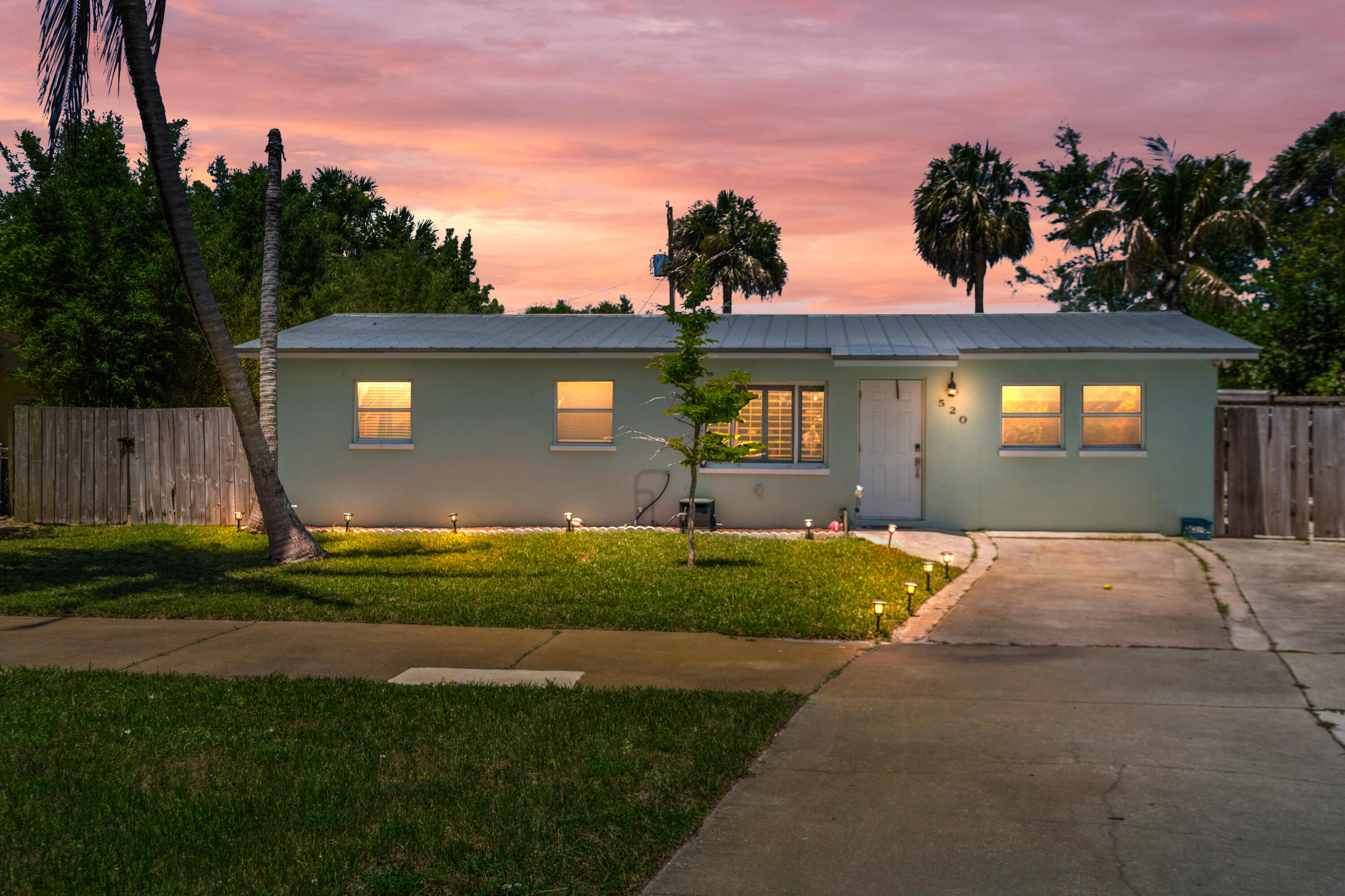 Welcome to 520 SE Dolphin Drive, a 4-bedroom, 2-bath concrete block home located in the heart of Stuart, just minutes from the beach and a short bike ride to downtown. This home features a split-bedroom layout, an updated kitchen with white shaker cabinets, quartz countertops, and stainless-steel appliances. Enjoy a fully fenced backyard with a covered patio and deck, perfect for relaxing or entertaining. No HOA, plus plenty of driveway space for a boat, RV, or extra parking.