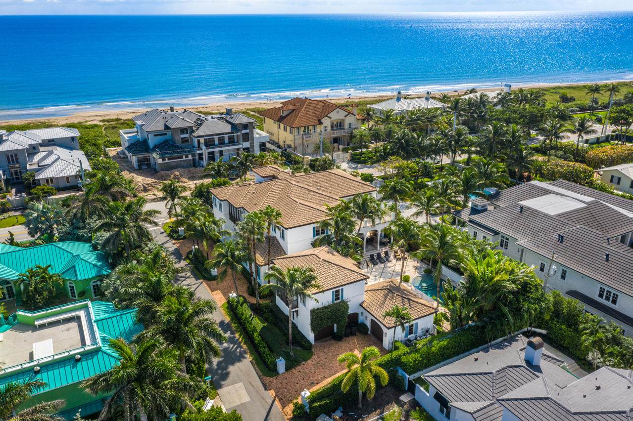 For those desiring the ultimate location, directly across from the Atlantic Ocean and in the heart of the vibrant lifestyle of Delray Beach, then 710 North Ocean is your place to call home. Designed by Randall Stofft, this gorgeous newly updated estate exudes casual elegance throughout. Featuring six bedrooms plus guest quarters, the home totals over 7,300 AC square feet and is constructed with the finest quality and craftsmanship. Upon entering, one is greeted with soaring ceilings and arched hallways leading to a bright an airy living room with a stone fireplace, a formal dining room served by a butler's pantry, theater room an office with floor to ceiling glass all enjoying the warm ocean breezes which provide the perfect atmosphere for year round entertaining. Conversation flows easily in the light filled family room with French Doors facing east and west, a wet bar and pool side breakfast room. Sure to attract the most enthusiastic chef is the spacious gourmet kitchen with gas cooktop, double ovens and expansive center island. The cozy loggia with coffered wood ceilings, summer kitchen, fireplace, and resort style pool is all about kicking back and relaxing with family and friends. Located above a beautiful staircase is a magnificent master suite with his and her baths, walk-in closets, east and west facing French doors, which open to a private balcony with an outdoor fireplace creating a true master retreat. Three additional beautifully appointed bedrooms all with private baths complete the second floor. A charming living space with ocean views commands the third level. Perched above the 3-car garage is a private guest quarter, which adds to the allure of the estate. Beautiful tropically landscaped grounds complete the secluded and peaceful setting and combine to make this one of the most compelling offerings in Delray Beach.