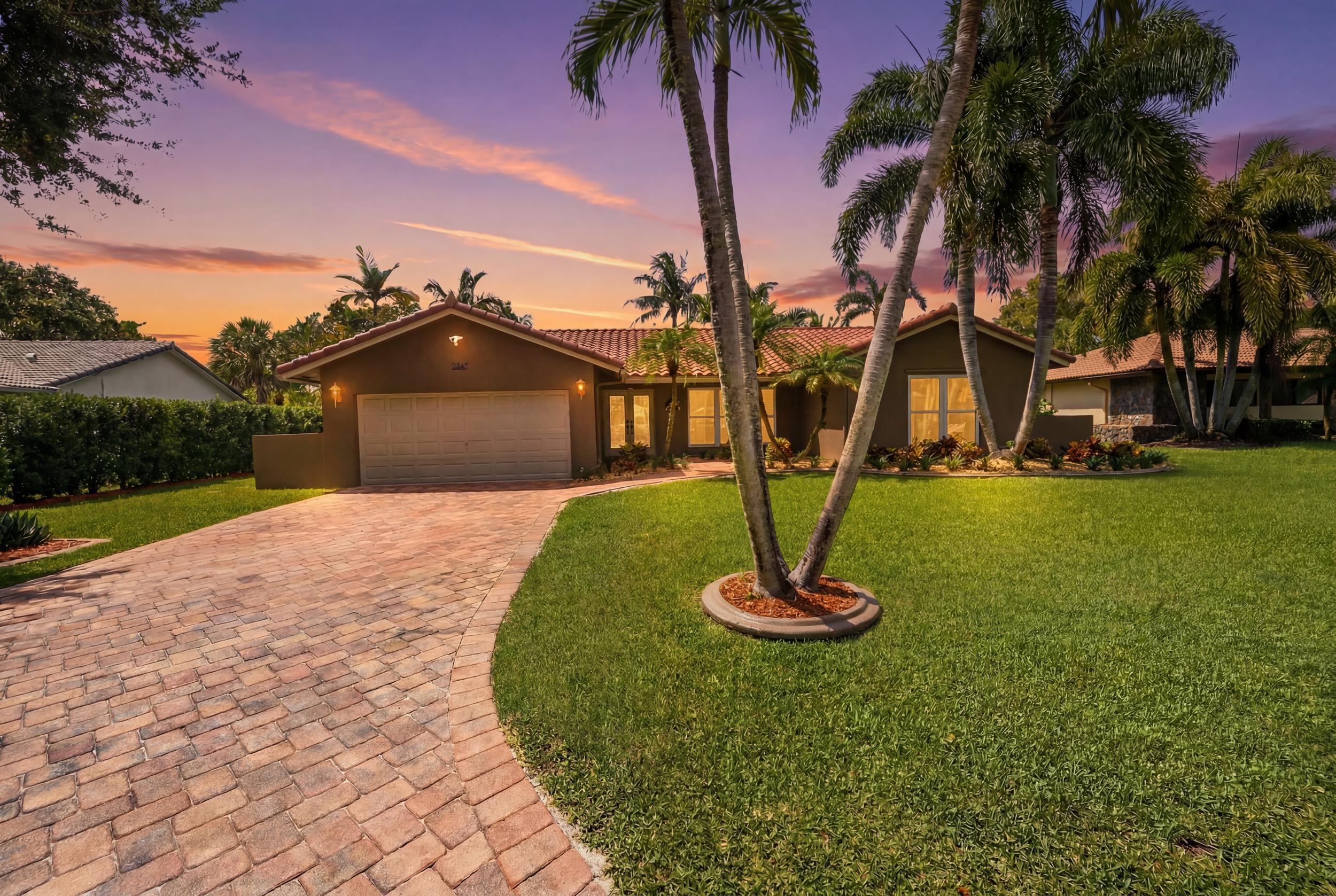 One of the few waterfront homes available in the highly desirable Maplewood neighborhood! Wide waterfront views and an .26 acre oversized tropically landscaped lot. Upgraded paver patio with heated pool & spa - watching the sunsets or entertaining in your backyard will be a dream here. Featuring a BRAND NEW 2026 ROOF. The whole house was just professionally painted to be bright, light, and ready for a new owner. Updated kitchen and bathrooms, large formal dining, living, and family rooms. Split bedroom plan. Primary bedroom is oversized and features a walk-in closet and updated cabana bathroom leading to the pool. Impact windows & shutters everywhere for whole house protection. Don't miss this one - schedule your showing today.