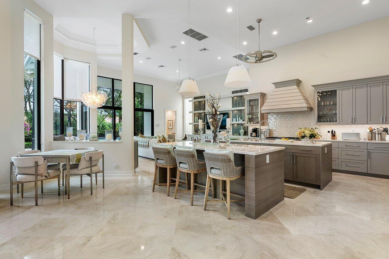 Enjoy the pinnacle of luxury living in prestigious and perfectly situated Estates of St Martin in Ballenisles. Completely renovated exceptional  home featuring 4 bedrooms,  4 and 2 half baths and 2 offices. This two story home boasts a new and modern kitchen, new bathrooms, new roof, and complete impact glass protection throughout. Tranquil views of manicured landscaping and the 8th hole of the east course from the patio with travertine pavers, summer kitchen and heated custom designed pool and Spa. The kitchen is truly stunning with two large center islands, Bosch and Wolf appliances, Sub zero fridge and effortlessly opens up to the grand living area displaying amazing features like floor to ceiling windows, coffered ceilings, and magnificent flooring. 2.5 car garage - Bring your golf cart! Also featuring a New waterheater, New pool heater, Air conditioning units are young as well - All of your major components have been replaced recently. Two ensuite bedrooms and loft space on the second floor is great for guests and a cozy space for entertaining. Exquisite details including Quartzite countertops throughout the home. Very Spacious Master Suite entails custom fitted closets, soaking tub and dual sinks. This breathtaking home is ready for you to move in, Schedule your showing today!

Ballenisles Country Club offers world class amenities and facilities, with three Championship Golf courses, Top Rated Tennis Facility, a beautiful Newly Renovated Clubhouse and sports complex, 6 Dining Options, Pickleball, Fitness Center, Gym, Sauna, Spa, Pool, Meeting Rooms, Dog Park, Walking Paths, Concierge Services and so much more!