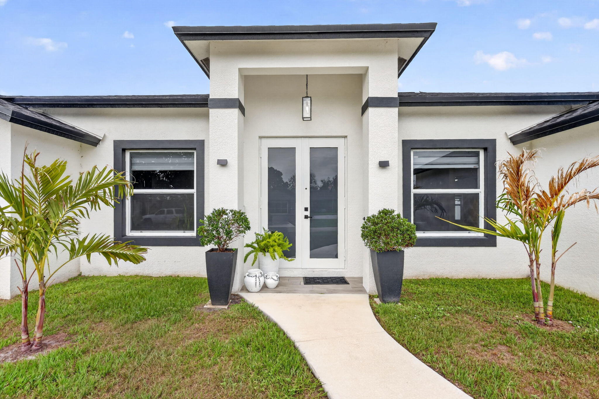Modern 2025-Built Home with NO HOA!! This beautifully designed 4-bedroom, 3-bath home features a spacious open floor plan with high ceilings, impact windows and doors, a large living area plus  a versatile den/office perfect for working from home. The modern kitchen offers quality wood cabinets, granite countertops, a waterfall island, stainless steel appliances, and ample storage space. Additional upgrades include Zebra blinds throughout, contemporary finishes, and a fully fenced backyard with vinyl fencing, providing both privacy and functionality. Conveniently located near shopping, dining, schools, parks, and approximately 3 miles from Florida's Turnpike. Seller prefers a 45-day closing to accommodate relocation plans.