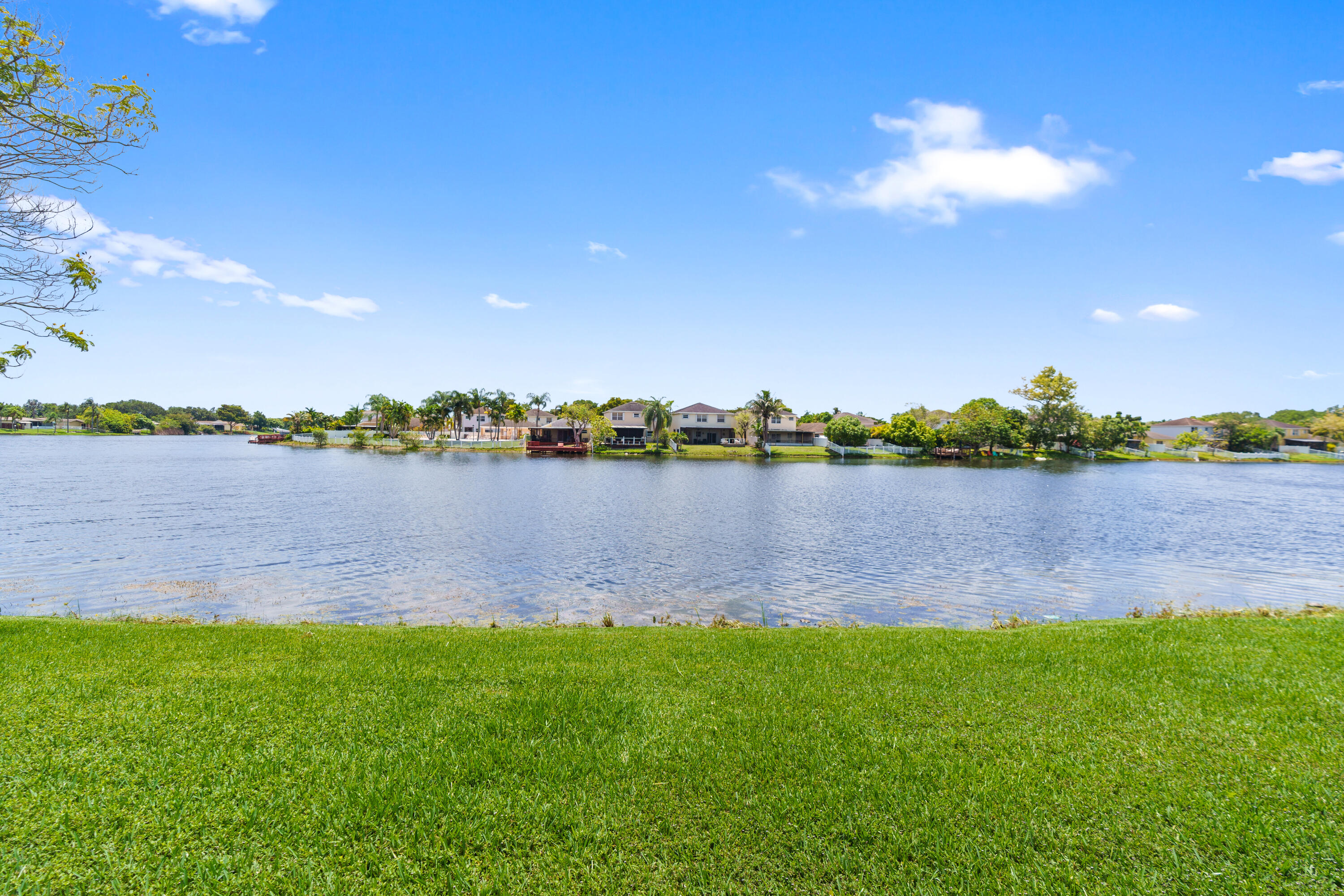 GORGEOUS LAKE VIEWS FROM THIS SPACIOUS 3 BEDROOM 2 BATH VILLA IN DESIRABLE GATED COMMUNITY OF FLAMINGO VILLAS IN PEMBROKE PINES*LAMINATE WOOD FLOORS*FRESHLY PAINTED*LARGE PRIMARY BEDROOM WITH WALK IN CLOSETS*BOTH BATHROOMS HAVE BEEN UPDATED* KITCHEN HAS WOOD CABINETS AND STAINLESS STEE APPLIANCES*WASHER & DRYER*HUGE SCREENED IN PATIO WITH AN AWNING TO ENJOY PEACEFUL VIEWS OF THE LAKE *CENTRALLY LOCATED ACROSS THE HOSPITAL, PEMBROKE LAKES MALL, CB SMITH PARK, SCHOOLS & RESTUARANTS*