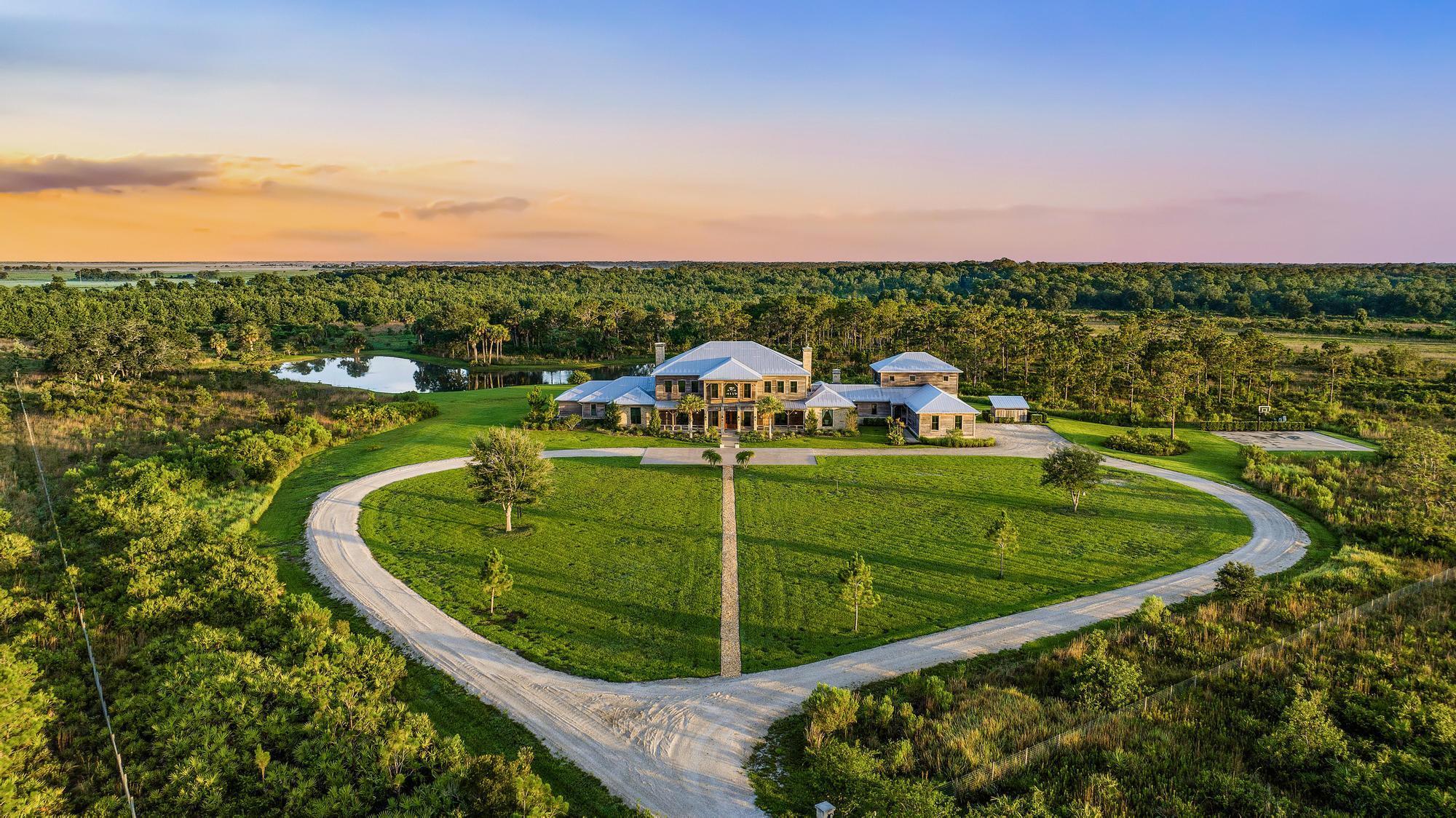 AUCTION BIDDING OPEN: Bidding ends May 29. Previously listed at $14.995M. Current high bid $6M. Showings by Appt. PineHaven Sporting Ranch presents an extraordinary opportunity within the exclusive Pine Creek Sporting Club dubbed ''the millionaire's gun club'' by CNBC. This magnificent Adirondack-inspired estate blends rustic warmth with sophisticated luxury across 40 pristine acres of Florida uplands. The grand entrance captivates with soaring beamed ceilings and natural materials, setting the tone for a residence designed for both intimate family gatherings and lavish entertaining. Generous living spaces flow seamlessly between the elegant bar and billiards area to the impressive trophy room and art gallery. The covered loggia extends outdoor living with a professional pizza oven and infrared grill overlooking serene lake views. The sumptuous primary wing offers a private sanctuary with its own plunge pool, while separate guest accommodations ensure privacy. Beyond the estate's boundaries, Pine Creek's five-star amenities awaitfrom guided hunts and sporting clays to gourmet dining and attentive concierge services.