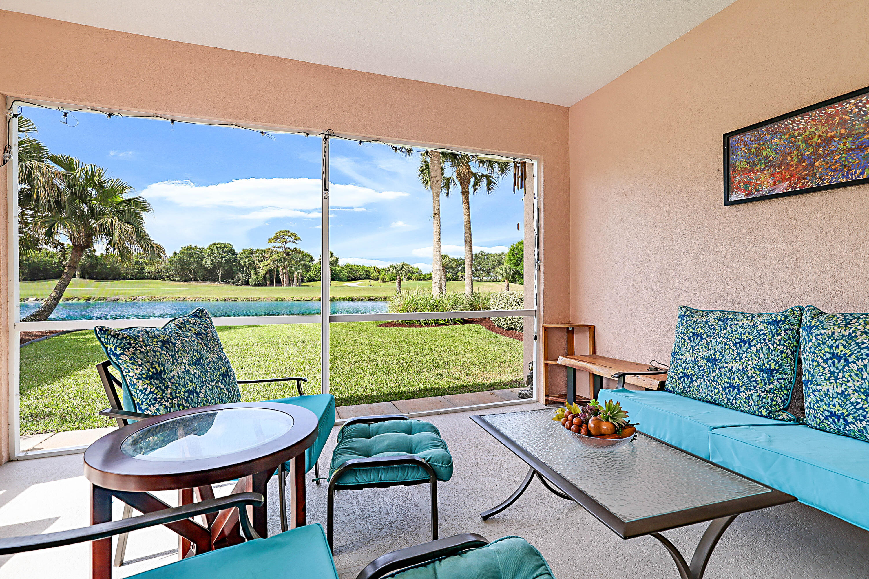 Stunning lakefront Capri villa with panoramic views of the lake and The Florida Club's 13th fairway. Enjoy spectacular sunset skies from the screened patio, where wide water views create a peaceful backdrop for everyday living. Offered furnished, this popular DiVosta floor plan features vaulted ceilings, a split-bedroom layout, plantation shutters, built-in storage, and an open design that lives larger than its footprint. A new roof installed in 2026 provides added value, peace of mind, and enhanced insurability. Located within one of Martin County's most desirable gated golf communities with tennis, pool, clubhouse dining, and optional public golf just minutes from shopping, dining, beaches, and I-95.