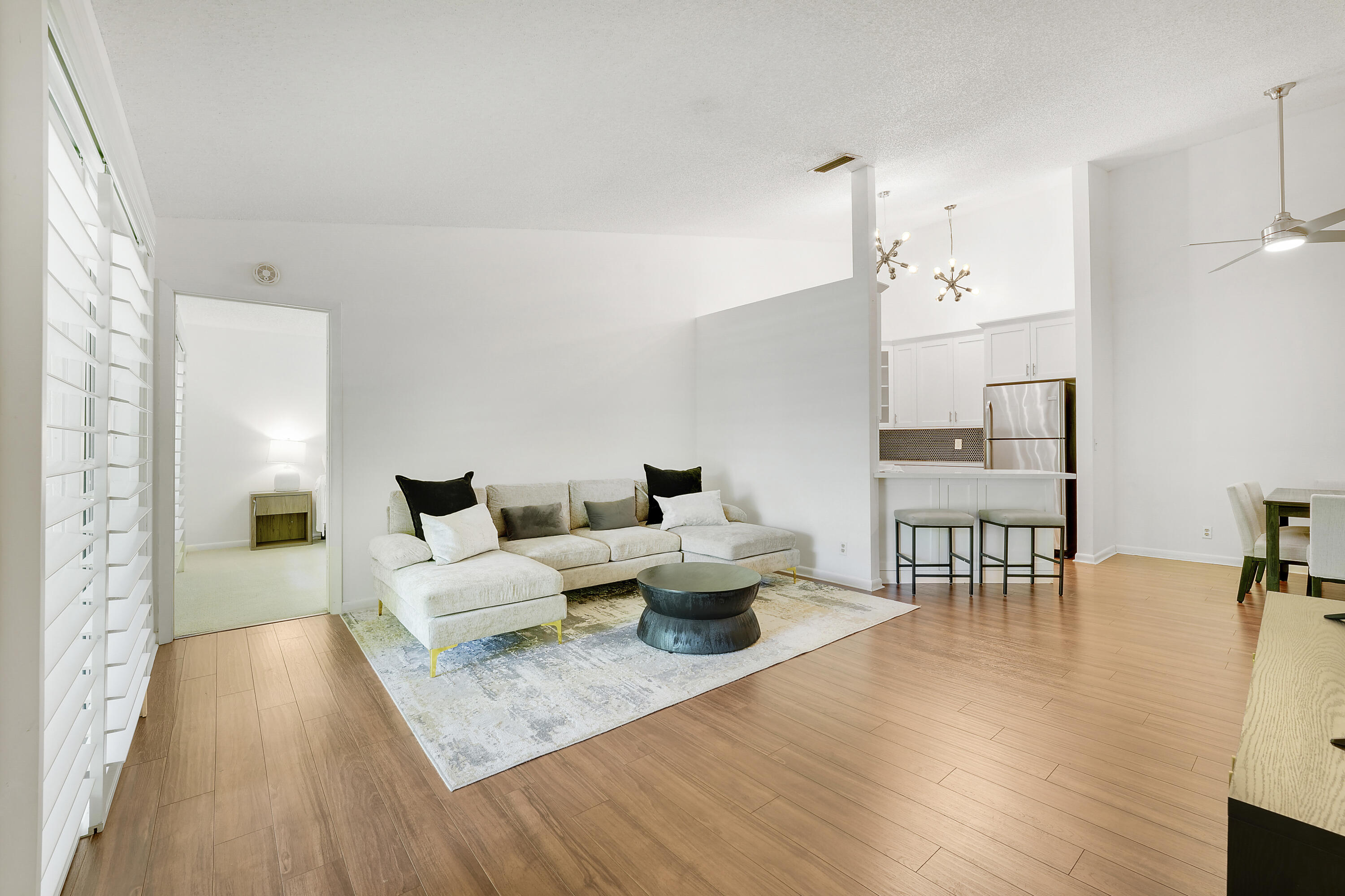 Move-in ready and beautifully updated 2-bedroom, 2-bath second-floor condo in desirable Chasewood Condo North! This bright and airy Jupiter residence features soaring vaulted ceilings, warm wood-look flooring, plantation shutters, a refreshed kitchen with white cabinetry, stainless steel appliances, modern lighting, and updated bathrooms with clean, contemporary finishes. The spacious living and dining areas flow easily to a private screened balcony overlooking lush tropical landscaping, creating the perfect spot to relax and enjoy indoor-outdoor Florida living. The primary suite offers comfortable space, generous closet storage, and peaceful natural views. Enjoy a well-maintained community setting with resort-style amenities including a sparkling pool, tennis courts, and beautifully landscaped grounds. Conveniently located near shopping, dining, parks, beaches, I-95, and the Turnpike, this condo offers the ideal blend of comfort, style, and Jupiter convenience.  Clean, updated, and ready for immediate enjoyment — schedule your showing​​‌​​​​‌​‌​​​‌‌​​​‌‌‌​​‌​​‌‌​​​​ today!