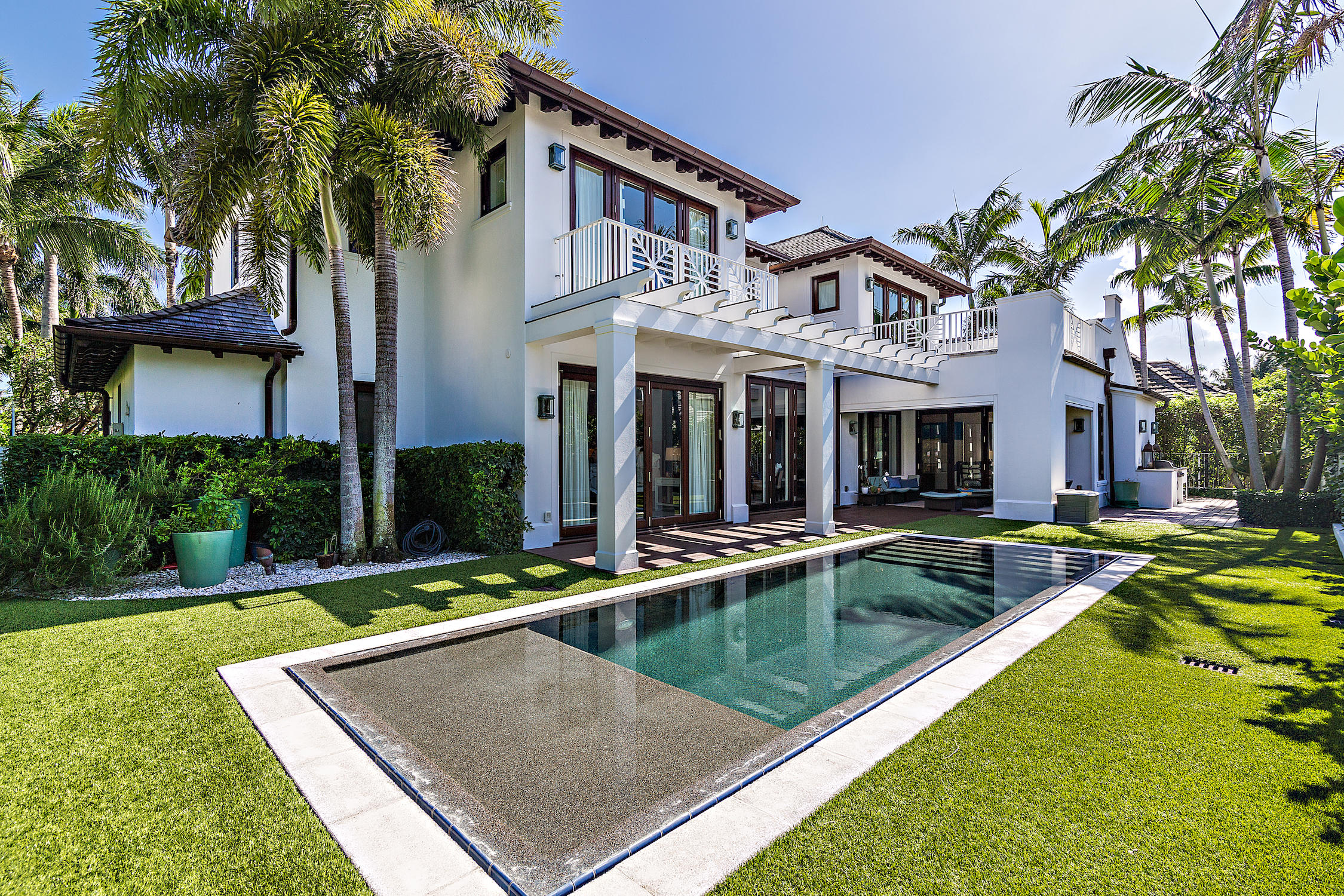 Beautiful Roger Jansen design, British West Indies home only 4 houses from the ocean and walking distance to the Beach Club and Palm Beach Country Club.