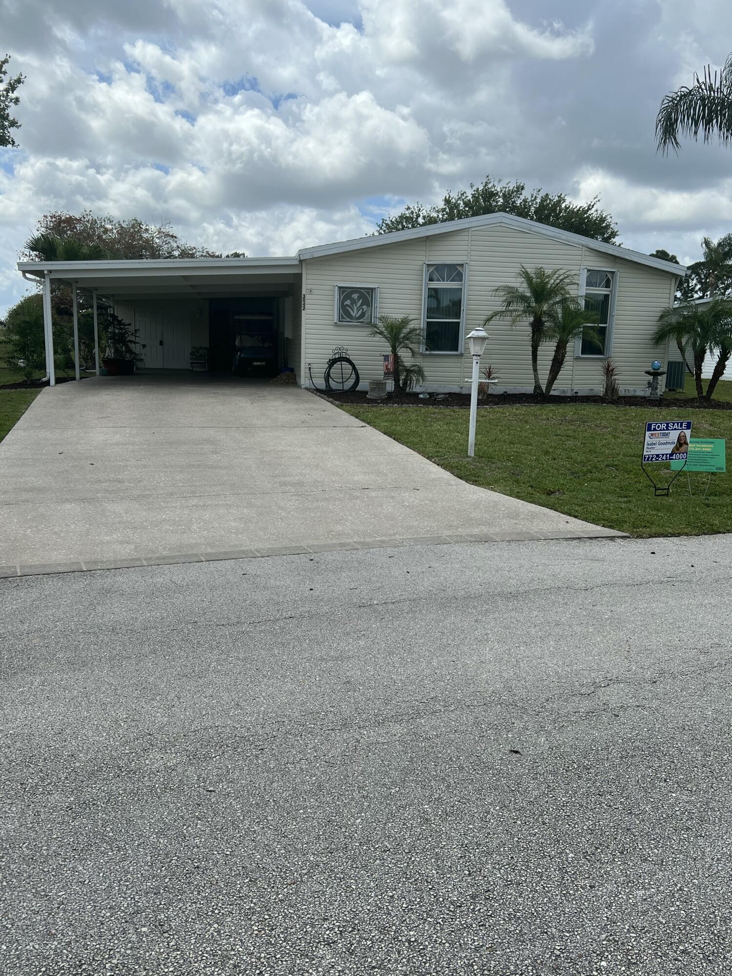 Beautiful 2-bedroom, 2-bath home with a den located in the highly sought-after 55+ community of Savannah Club in Port St. Lucie. This well-maintained modular home offers 1,566 sq ft of living space and 2,578 total sq ft, featuring a spacious layout, screened porch, and covered carport. The wide concrete driveway provides ample parking, including space for a golf cart. Enjoy resort-style living with community amenities, activities, and a prime location close to shopping, dining, and major roadways. Land lease community with monthly lot rent. Don't miss this opportunity to enjoy Florida living at its best!
