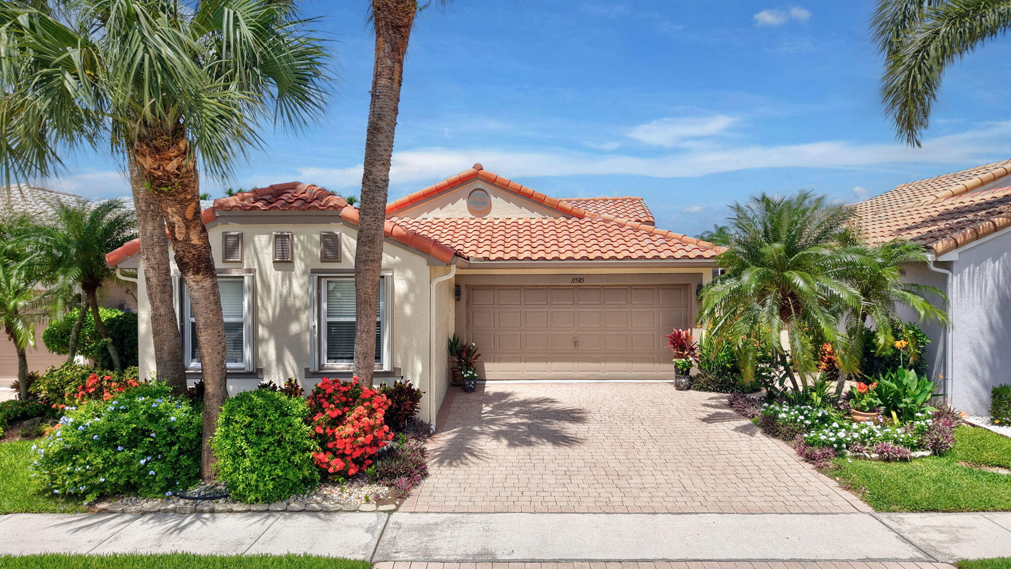 Tucked inside The Cascades, one of Boynton Beach's most established guard-gated 55+ communities, this 3 bedroom, 2 bath home offers 1,672 square feet of living space with a peaceful lake view from the rear lanai. The split bedroom floor plan keeps the primary suite privately separated from the guest wing, and tile flooring runs throughout the main living areas. The kitchen anchors the home with light wood cabinetry, black granite countertops, stainless steel appliances, and a sunny breakfast nook that looks straight out over the water. A dining area and a foyer with a built in dry bar add an elegant touch for entertaining.  The primary suite offers direct access to the screened lanai, a large walk-in closet, and a spacious master bathroom featuring dual vanities, a separate walk-in shower, and a Roman tub. The guest bedroom and full bath sit privately on the opposite side of the home. The third bedroom features double pocket French doors with a solid cherry wood built-in desk and shelving that convey with the home. Great as a home office, family room, or guest room.  Enjoy the convenience of a spacious laundry room with a window that provides abundant natural light. Complete with a newer washer and dryer. Impact windows protect the primary suite and guest bedroom, with hurricane shutters covering the rest of the home for complete storm protection.  The expansive screened lanai provides the perfect space for outdoor living and features a retractable awning for comfortable shade. The backyard opens to a tranquil lake view, a feature that typically pushes comparable Cascades homes well above this price point.  Living in The Cascades means resort-style living every day. The 18,000 square foot Grand Clubhouse anchors a long list of amenities: two heated pools, an outdoor hot tub, a full fitness center, an aerobics and dance studio, six lighted Har-Tru tennis courts with a USTA pro on staff, two pickleball courts, two Har-Tru bocce courts, three shuffleboard courts, a golf putting green and private driving cage, a grand ballroom and theatre that seats 400, a billiards room, card and poker rooms, a library, an arts and crafts studio, and an onsite cafe. The HOA also handles exterior painting, roof cleaning, lawn and landscaping, common area maintenance, basic pest control, trash removal, high-speed internet, and cable with DVR. Most of the upkeep is already taken care of.  The location adds even more value. Publix is one mile away, Bethesda Health City is under two miles, and you're minutes from Florida's Turnpike and I-95. Green Cay Nature Center and Wakodahatchee Wetlands are both just down the road, and the beach is a quick 20-minute drive.  Homes with this view and this amenity package don't sit on the market long. Schedule your private showing today.