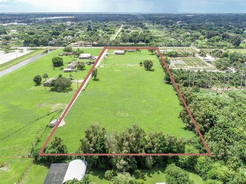 Opportunity to own a a large lot in beautiful town Southwest Ranches. 9.65 acres of cleared and semi filled land. Perfect for developing, nursery, or horse ranch. Includes completely remodeled 3 bedroom, 3 bath plus office space single family home with new tile floors throughout, brand new kitchen with quartz counter tops and stainless steel lg studio appliances, remodeled bathrooms, recessed lighting throughout, linear a/c vents, two new a/c units w smart nest thermostats, new smart water heater. House has been freshly painted and stucco has been redone. New Septic Tank. Electric gate, and Podocarpus live fence. Property also includes a 3,600 sf two story barn that can be used for storage or as a large garage. Excellent location close to I-75. Excellent schools.