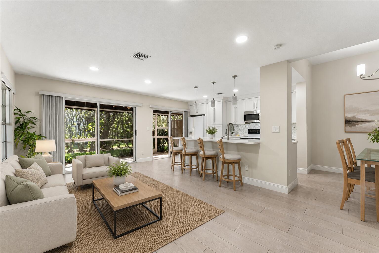 Priced to sell! Rarely available end-unit townhome in the highly sought-after Fairfield community, offering the perfect blend of privacy, convenience, and resort-style living. Ideally located just minutes from Town Center Mall, Boca's beautiful beaches, and major highways, with a private community walking path providing direct access to Boca Center's shopping, dining, and entertainment.  This beautifully updated 3-bedroom, 2.5-bath home features a new roof (2024), A/C (2021), freshly painted exterior, accordion hurricane shutters throughout, remodeled kitchen, updated primary bath and powder room, elegant Italian tile flooring, and fresh interior paint. The open-concept floor plan is filled with natural light and designed for both everyday living and entertaining. Upstairs, soaring vaulted ceilings enhance the spacious feel, while the oversized primary suite offers a flexible sitting area or home office space, custom closets, and a peaceful retreat. A versatile loft provides additional living space perfect for a media room, office, fitness area, or playroom. Additional features include an indoor laundry room and a 2-car garage.  The desirable end-unit location offers exceptional privacy and tranquil views of lush landscaping, mature trees, and beautiful green space. Relax on the screened patio and enjoy the serene, park-like setting right outside your door.  Fairfield is a gated community with 24-hour manned security and outstanding amenities, including a clubhouse, heated pool, spa, tennis courts, playground, basketball court, racquetball court, and multiple recreational areas throughout the community.  Located within Boca Raton's highly rated school district and just minutes from beaches, shopping, dining, and entertainment, this move-in-ready home offers an exceptional lifestyle in one of Boca's most desirable communities.  Beautifully updated, ideally located, and competitively priced—don't miss this opportunity!