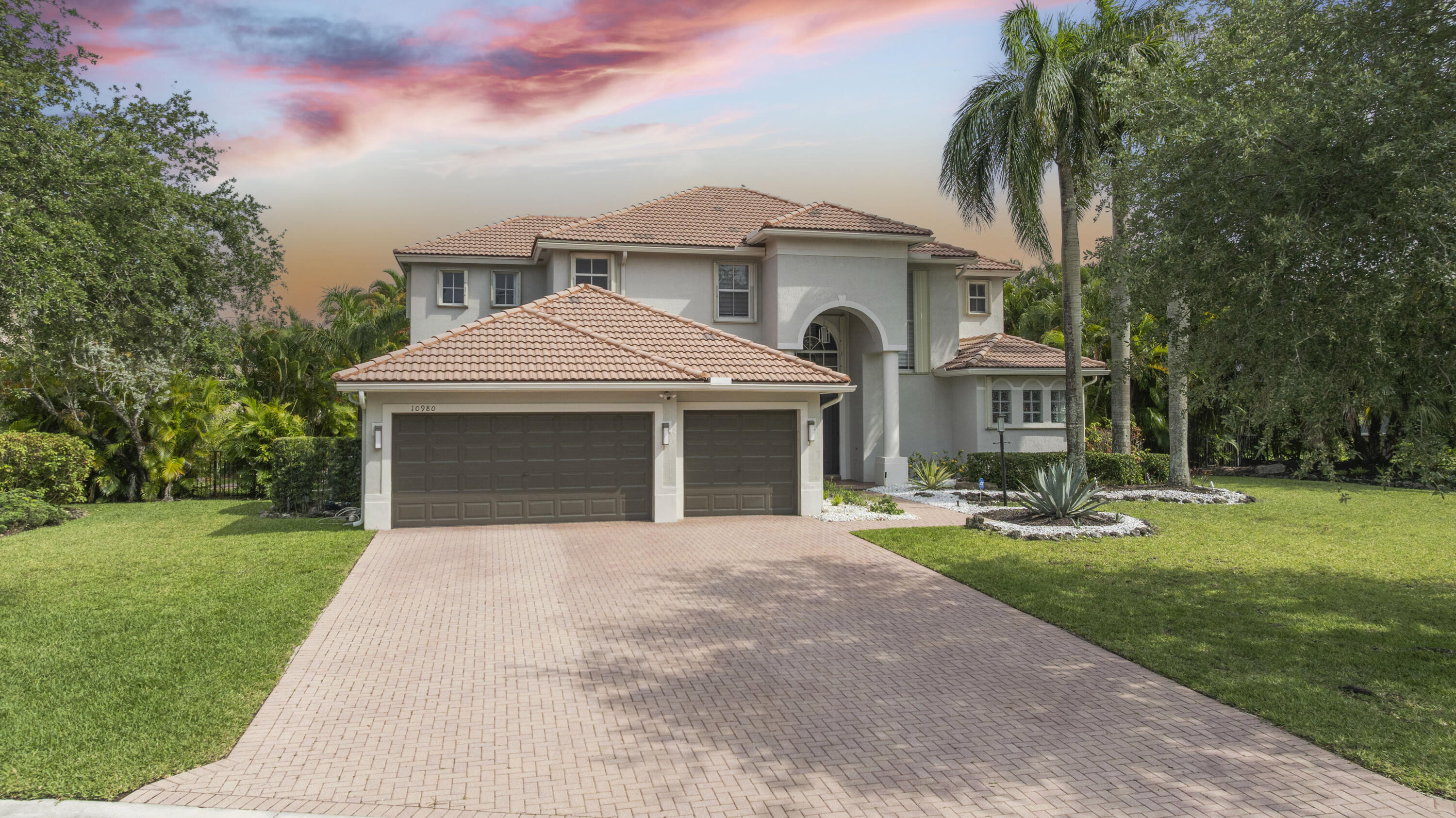 Parkland Isles' Crown Jewel has finally hit the market! This breathtaking 4,000+ SF waterfront estate was renovated with no expense spared, featuring over $500,000 in luxury upgrades. Showcasing stunning European cabinetry throughout, polished porcelain flooring downstairs, designer wood tile upstairs, and a jaw-dropping spa-inspired primary bathroom. The open-concept layout flows seamlessly to your private backyard oasis with a resort-style pool and serene lake views. Located in one of Parkland's most sought-after gated communities with top-rated schools, this home is the definition of luxury living.