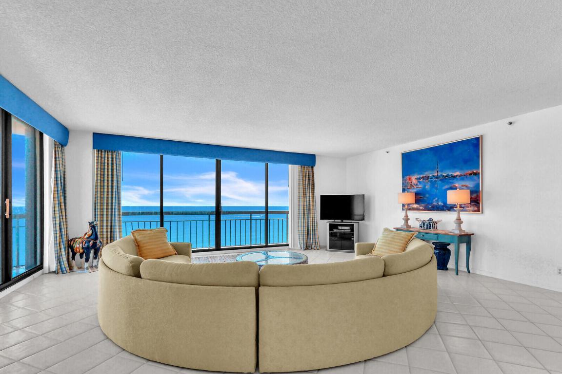 Have you been scrolling Zillow like it was a second job, half-panicking, half-dreaming, looking for the perfect condo to rent? And wondering if the photos are accurate, if the view is as good as it looks, and if you'll feel at home when you get there. I understand how you feel, and I will say, if you end up renting this condo, your future self will thank you. The second you open the door, it's pure glass. Two full walls of floor-to-ceiling windows wrap around the unit. You can see both the ocean and the Intracoastal, sunrise on one side, sunset on the other. And the unit is really big, over 2,000 square feet, so you won't be tripping over your partner or guests. There are 2 bedrooms, 3 full baths (one in the guest bedroom and 2 in the master bedroom), plus my favorite, there is a powder bathroom, where you will also find the washer/dryer (not that you have to do laundry, but it's there if you need it). The unit is furnished/turnkey, so it has everything you need and even things you didn't know you'll need (like binoculars, for checking out sealife, not your neighbors). You can literally walk in with your suitcase and start living. The building? A vibe. There's a manned gate, garage parking, and even an on-site restaurant, no Uber Eats required. The pool deck is having work done, but, 1 of the 2 pools is scheduled to reopen by the end of December. But really, who needs it when the ocean is downstairs right at your fingertips? And this part of Singer Island has beach service, so you don't even have to carry beach chairs and umbrellas, just your favorite book and a towel. There is a lot to do right here on Singer Island, brunch at Sailfish Marina, walks through MacArthur Park, Brightline rides to Miami, or just barefoot coffee strolls along the shoreline pretending you're a local, because you basically are. So yeah, if you're still scrolling and stressing, I get it. But future you? They'll be out on that balcony, wine in hand, texting everyone a photo of the view, saying, "Best. Decision. Ever."
