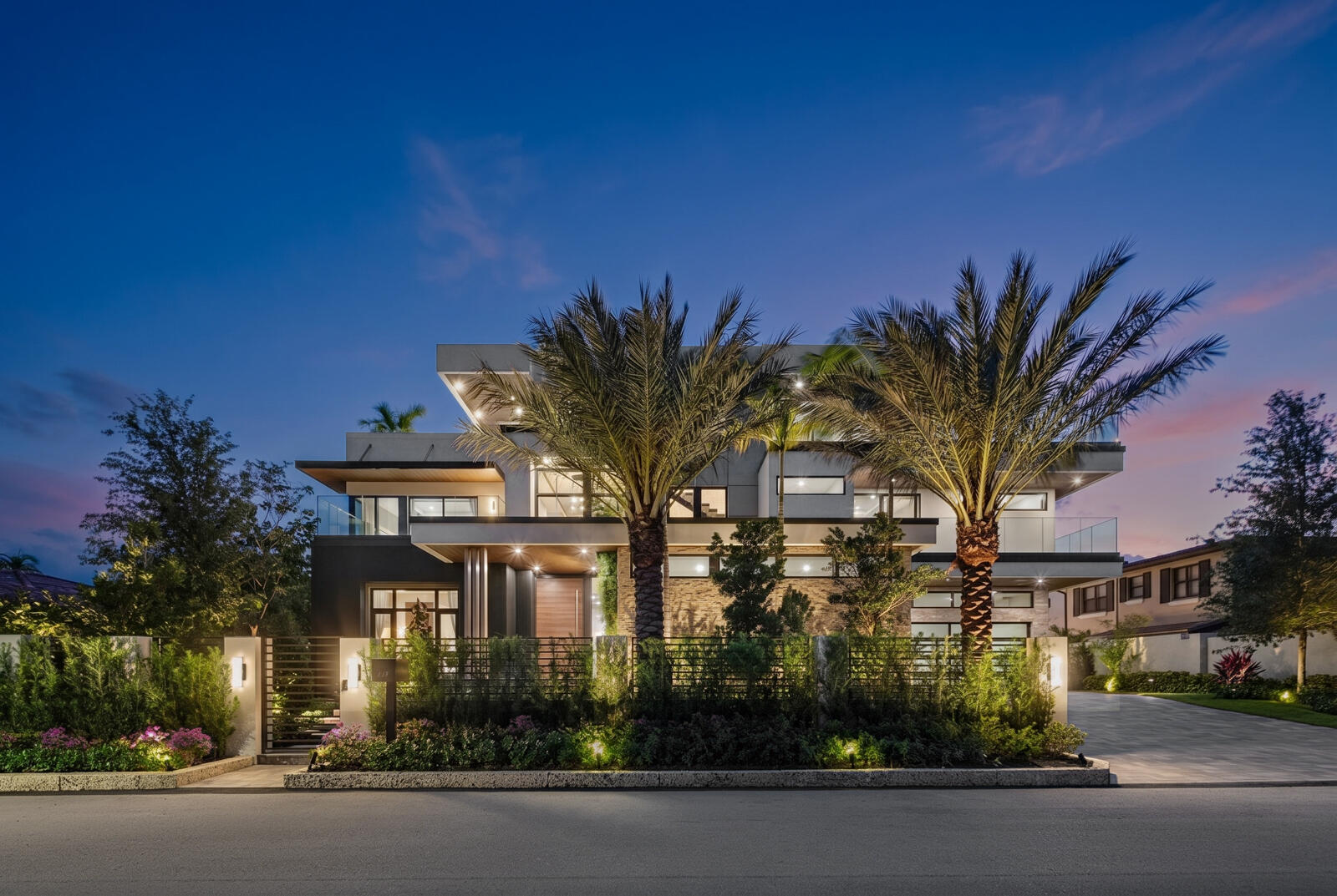 Discover unparalleled modern waterfront luxury in this magnificent New Construction Estate located in the prestigious Las Olas Isles of Fort Lauderdale!  Approaching the estate is an experience unto itself. Travel along one of Las Olas Isles' most prestigious avenues, where magnificent waterfront estates line one side of the street while breathtaking open-water vistas and impressive mega-yachts grace the other. Towering Coconut Palms frame the boulevard, complemented by underground utilities and charming European-style street lighting—an exclusive distinction enjoyed by only this street within Las Olas. Encompassing approximately 9,500 square feet of meticulously crafted living space across three expansive levels, this architectural Masterpiece sits on a generous 13,000-square-foot lot with 100 feet of prime deep-water frontage. Accommodating large vessels with ease, this property offers a wide turning basin nearby and effortless ocean access within minutes by boat.  Designed for both grand-scale entertaining and luxurious everyday living, this extraordinary residence features (8) oversized Bedroom Suites, (8) Full Bathrooms, and one Half Bath. A dramatic three-story floating glass staircase serves as a striking centerpiece, complemented by an oversized elevator providing seamless access to all floors. Floor-to-ceiling Impact Windows and Doors flood the home with natural light while showcasing breathtaking water views from nearly every room.  The culinary experience is elevated with a full chef's kitchen and separate catering kitchen, outfitted with premium Wolf and Sub-Zero appliances, European custom cabinetry, backlit quartzite stone, oversized islands, and expansive prep areas ideal for entertaining. (3) custom wet bars are thoughtfully placed throughout the home, while (2) designer fireplaces add warmth and sophistication to the living and entertaining spaces. Two full laundry rooms enhance functionality for effortless daily living.  Outdoor living reaches new heights with nearly 7,000 square feet of covered and open-air patios, decks, and balconies designed for year-round enjoyment. The spectacular rooftop level features a unique five-hole putting green with panoramic views of the waterways and city skyline, while the dedicated third-floor club room offers wraparound balconies, a 2nd outdoor fireplace, and one of two fully equipped summer kitchens—perfect for sunset entertaining and private gatherings.  Additional resort-style amenities include a private gym, sauna, air-conditioned boat tackle room, and dedicated outdoor cabana bath for poolside and dockside ease. Full custom SMART home automation, triple-insulated walls & roof, 5/8" moisture resistant drywall, and premium finishes throughout demonstrate superior craftsmanship and forward-thinking design.  The gated property also features an impressive (up to) eight-car garage and motor court, providing ample space for luxury vehicles and guests. Positioned within walking distance to the beach and vibrant Las Olas Boulevard, and just minutes from Fort Lauderdale-Hollywood International Airport, this exceptional estate delivers the ultimate South Florida lifestyle with unmatched elegance and privacy.