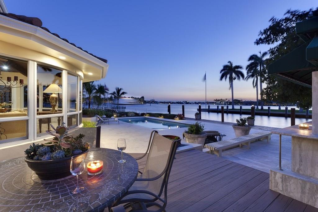 Filled with scenic water views, this beautifully appointed residence totals 4,856+/-  square feet with four bedrooms, five full baths, and a two-bay garage.  Amenities include a back-up generator, central vacuum system, built-in sound system, LED recessed lighting, and a durable metal roof with the look of interlocking tile.  Marble floors flow through most of the main level.