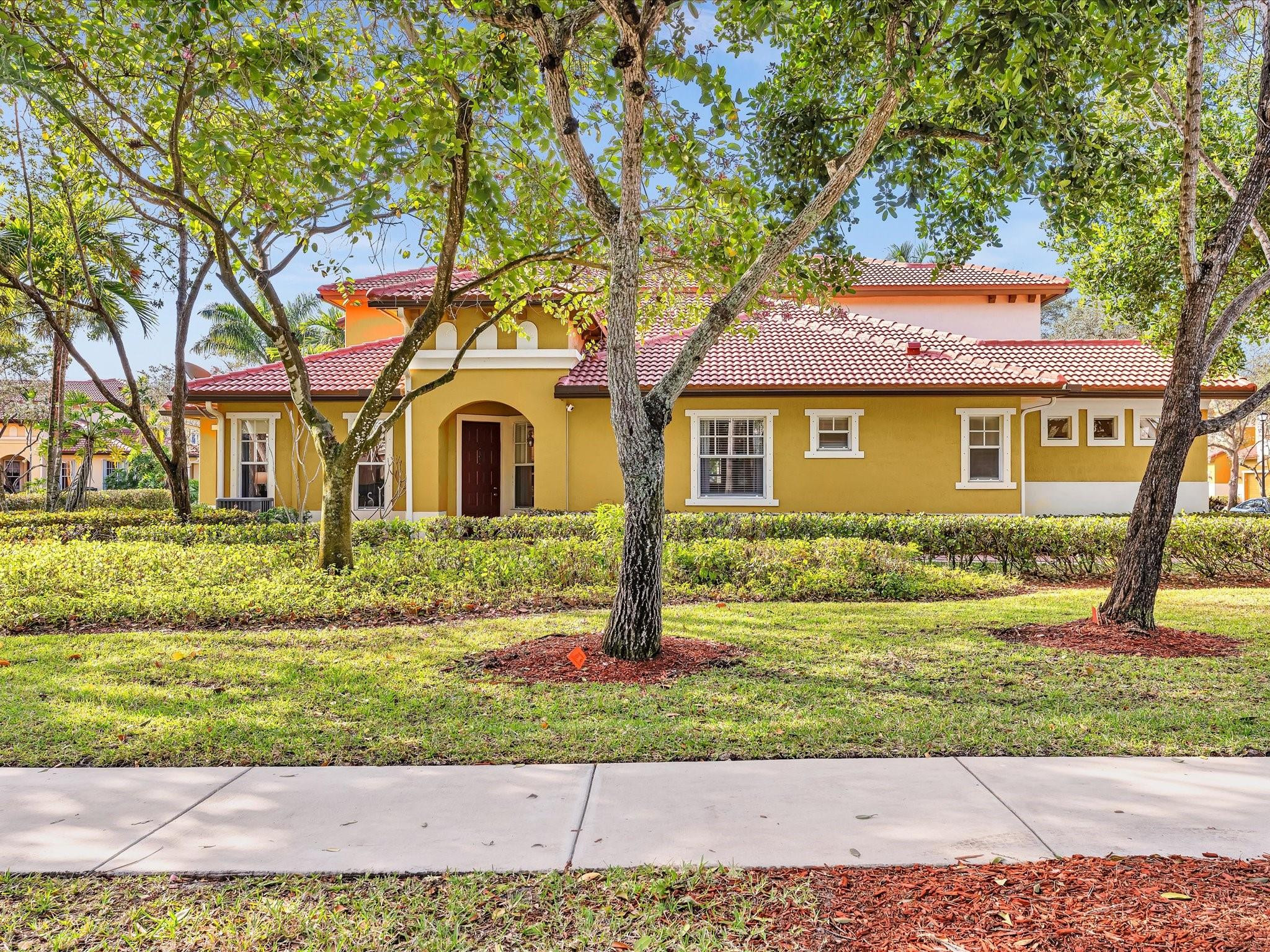 Experience coastal South Florida living in this corner home in Tuscany at Heron Bay. Beautifully renovated, it features wood-like porcelain tile, recessed lighting, motorized blinds, & designer fixtures. The gourmet kitchen shines with wraparound quartz countertops, glass subway tile backsplash, deep stainless steel sink, wood cabinetry, & newer stainless steel appliances. The flexible third bedroom, currently a den, can easily convert back. The spacious primary suite offers a walk-in closet & bath with dual sinks. Enjoy resort style living with two clubhouses, fitness center, playground, large pools, tennis, pickleball, basketball courts & guard-gates. Maintenance covers roof, insurance, exterior, sewer, trash, alarm, landscaping, & amenities. Heron Bay is zoned for only Parkland schools.