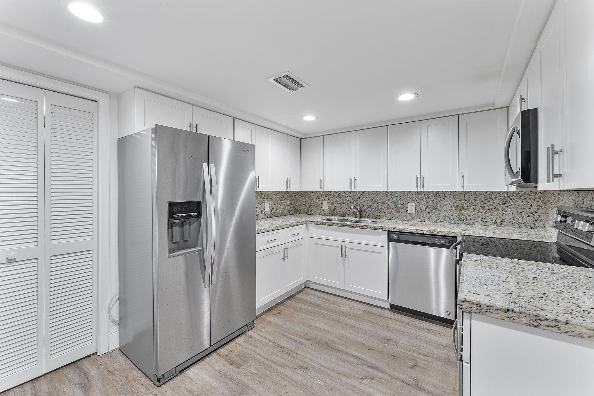 Move-in ready and beautifully updated in highly desirable Weston.This spacious 2 Bedroom, 2.5 Bath condo features a smart Split Floor plan with two Ensuite Bedrooms, generous closet space, and additional storage. The Modern Kitchen offers Shaker Cabinetry, Stainless Steel Appliances, and Stone Countertops, opening to bright and updated flooring. Relax on the oversized screened Balcony with hurricane shutters and enjoy the easy South Florida lifestyle. Highlights include in-unit Laundry, newer A/C, Tankless Water Heater, assigned parking, and plenty of guest parking. Located in a secure, well-maintained community with Pool and Amenities, close to shopping, dining, parks, golf, and major highways. Maintenance includes cable and internet. A standout Weston value that is ready to impress.