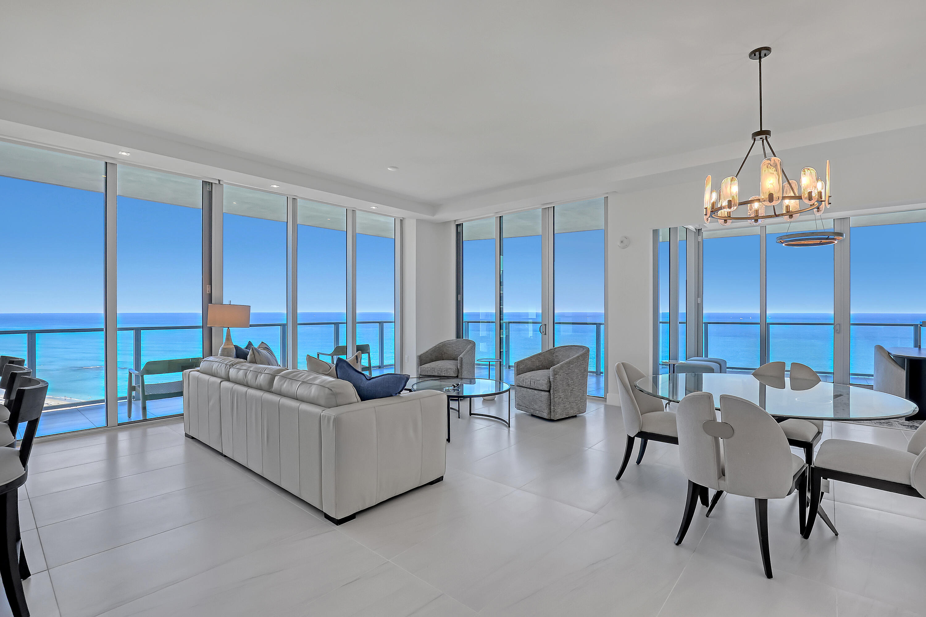 Welcome to Amrit Ocean Resort & Residences, an extraordinary oceanfront community on Singer Island where luxury living meets a world-class wellness lifestyle. This beautifully appointed 2-bedroom, 2.5-bath residence spanning 2,065 square feet offers a rare opportunity to enjoy breathtaking Atlantic Ocean views from a higher vantage point within one of South Florida's newest and most innovative resort residences. Upon entering, the home immediately opens to sweeping water views through floor-to-ceiling impact glass, filling the living spaces with natural light and connecting seamlessly to a spacious private terrace overlooking the ocean.  Designed for both comfort and entertaining, the residence features a sleek European-style kitchen equipped with premium Miele appliances, quartz countertops, a wine refrigerator, and a fully integrated wet bar. Life at Amrit is centered around wellness, relaxation, and elevated resort-style service. Residents enjoy access to multiple oceanfront pools, spa pools and hot tubs, beachfront cabana service, and a serene outdoor yoga terrace overlooking the Atlantic. The property's expansive spa and wellness center offers advanced treatments and cutting-edge therapies designed to enhance health and well-being. Beyond the wellness offerings, Amrit delivers a true five-star resort experience with four on-site dining venues, 24-hour security, valet service, EV charging stations, and a fully staffed lobby with concierge services. Residents also enjoy private amenities including a heated ocean-view pool, daybed lounges, whirlpool spa, state-of-the-art fitness center, meditation garden, social lounge with bar, catering kitchen, billiards and entertainment space, private card room, and outdoor social terrace with grilling area. Don't miss this incredible opportunity to own the best residence in all of the Amrit.