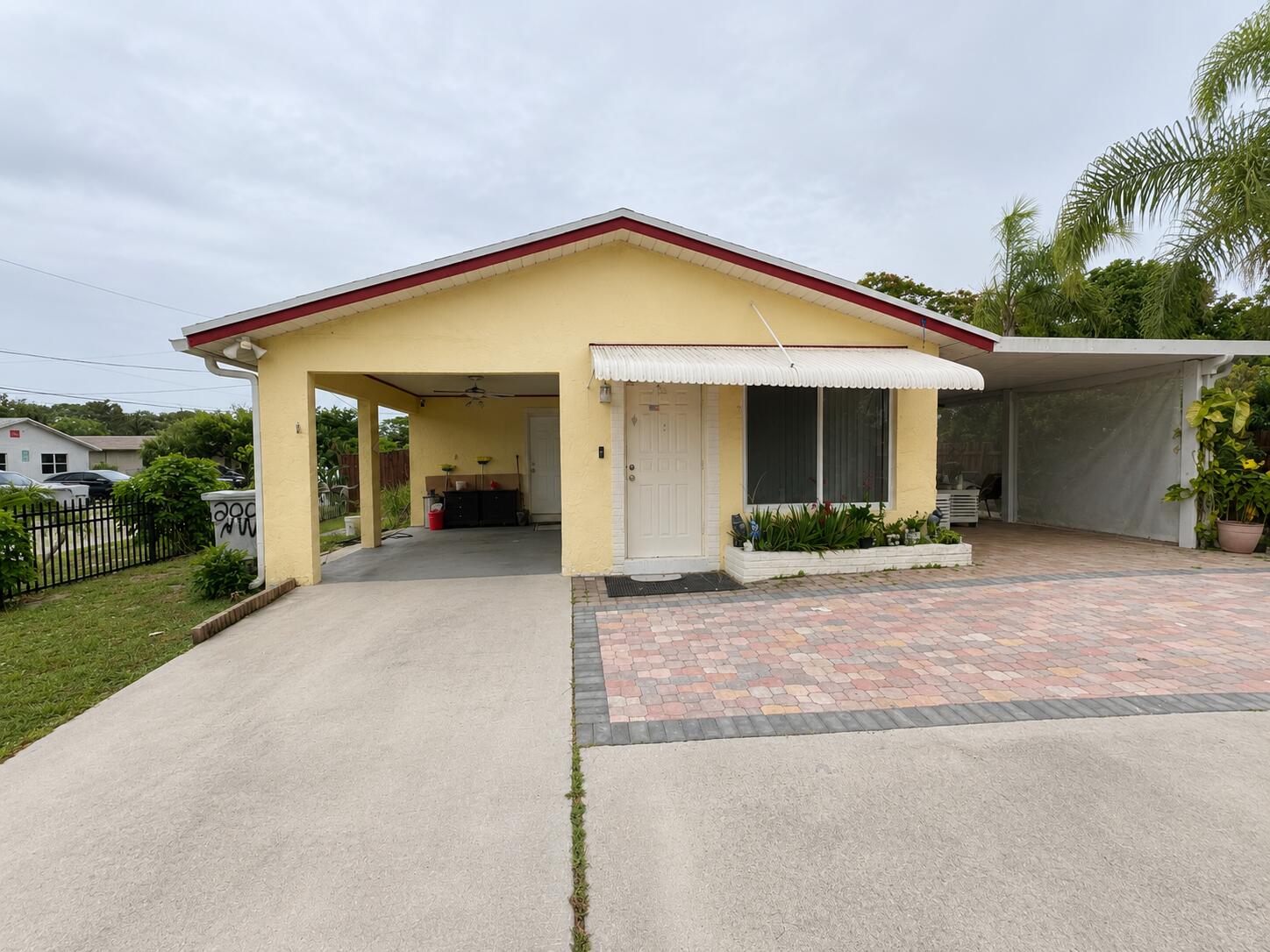Well kept 3 bedroom, 2 bath single family home 1,143 sqft of living space on a corner lot in Pompano Beach. This one story home features a practical layout with comfortable living areas, tile flooring, and an easy flow between the living, dining, and kitchen spaces. The bedroom layout offers flexibility for family, guests, a home office, or additional storage. Outside, enjoy an open porch, covered parking, and a spacious backyard with room to relax, entertain, garden, or create your own outdoor setup. Conveniently located near shopping, dining, schools, major roads, and all that Pompano Beach has to offer.