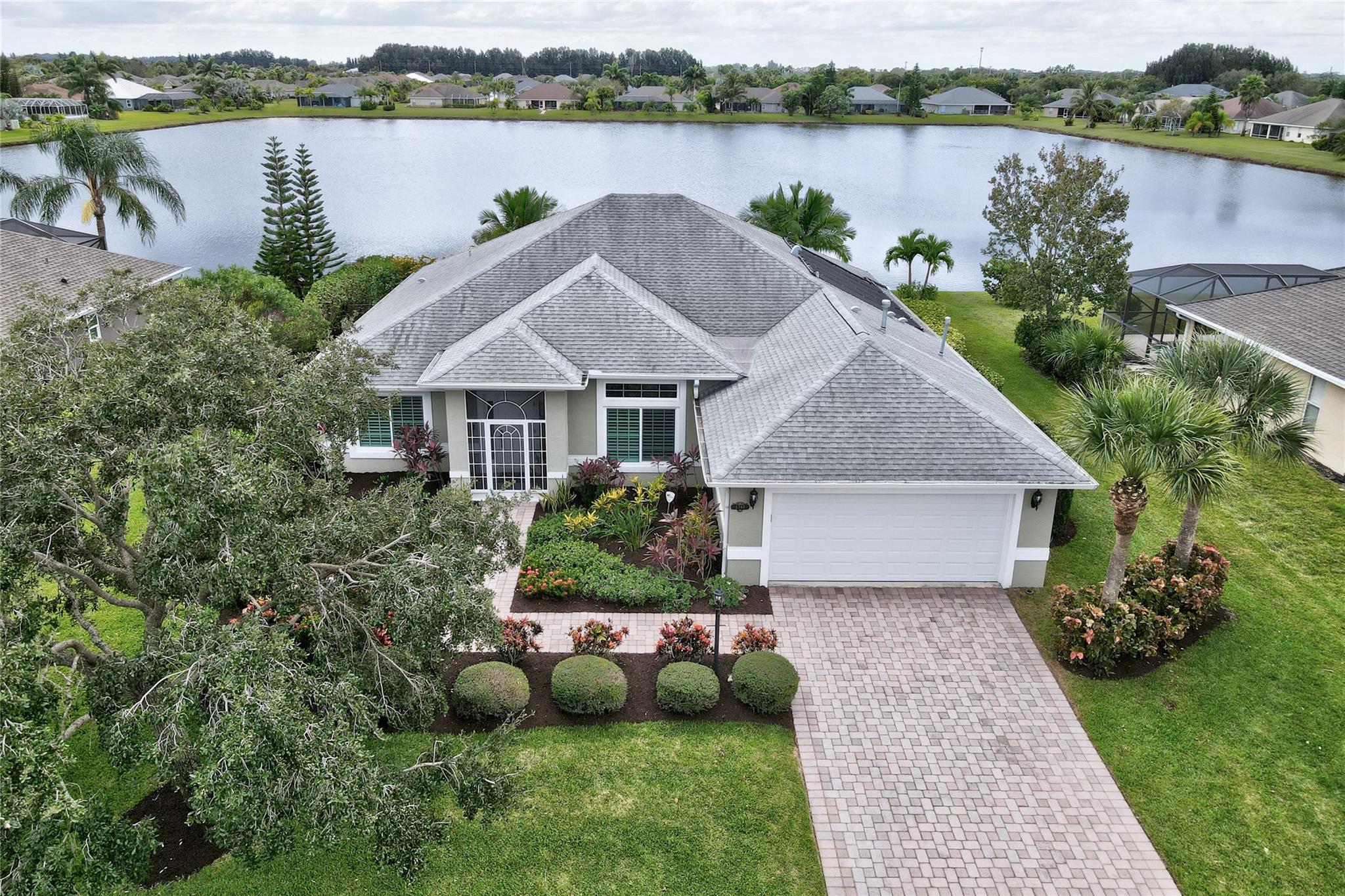 REMARKABLY upgraded lakefront POOL home! Whole house & pool generator (2015) with natural gas. Freshly painted, mature and meticulous landscaping. Roof 2017 (50year transferable warranty), 2016 HVAC, 2017 Solar Panels (FPL bill<$35per mnth), split floor plan. Primary bdrm has 2 walk in closets, dual sinks. Energy efficient, sound barrier, SOLID poured concrete Royal Walls. Roof-solar attic fan, extra insulation, new plywood, rubber underlayment & extra tie-downs. ALL IMPACT WINDOWS&DOORS exceed Miami/Dade rqrmnts, new exterior lighting, dog run, LUX vinyl floors in bdrms. +screened front porch