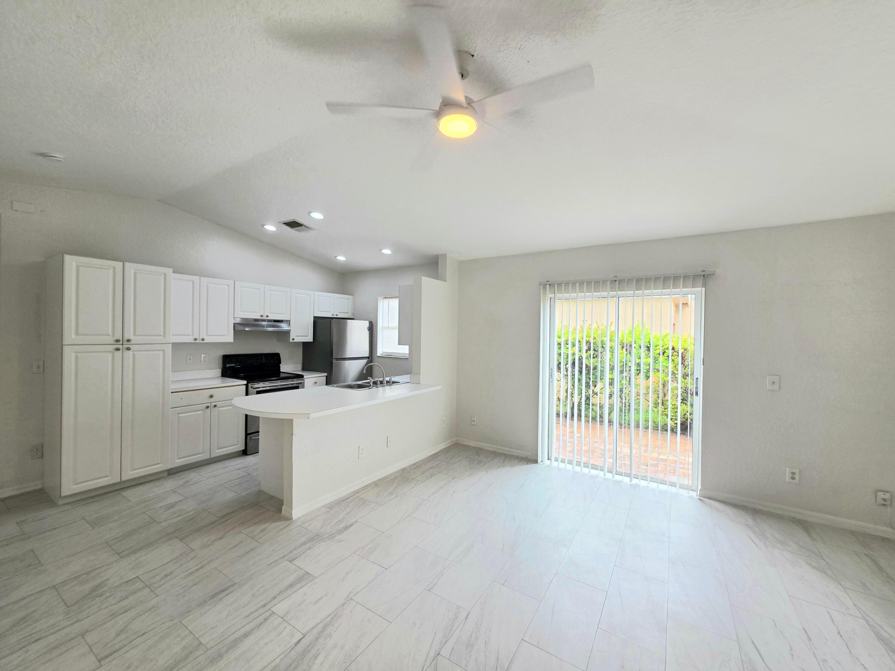 This freshly painted and clean 3-bedroom, 2-bathroom house features brand-new tile flooring installed throughout the entire residence. Vaulted ceilings in the open area (living room and the kitchen). The kitchen is equipped with a brand-new refrigerator and dishwasher.  Each bathroom includes a newly constructed built-in shower, and the exterior features pavers located outside of the living room area. The house also has a one-car garage.   One cat is allowed. Please note that water utilities are not included in the rent.
