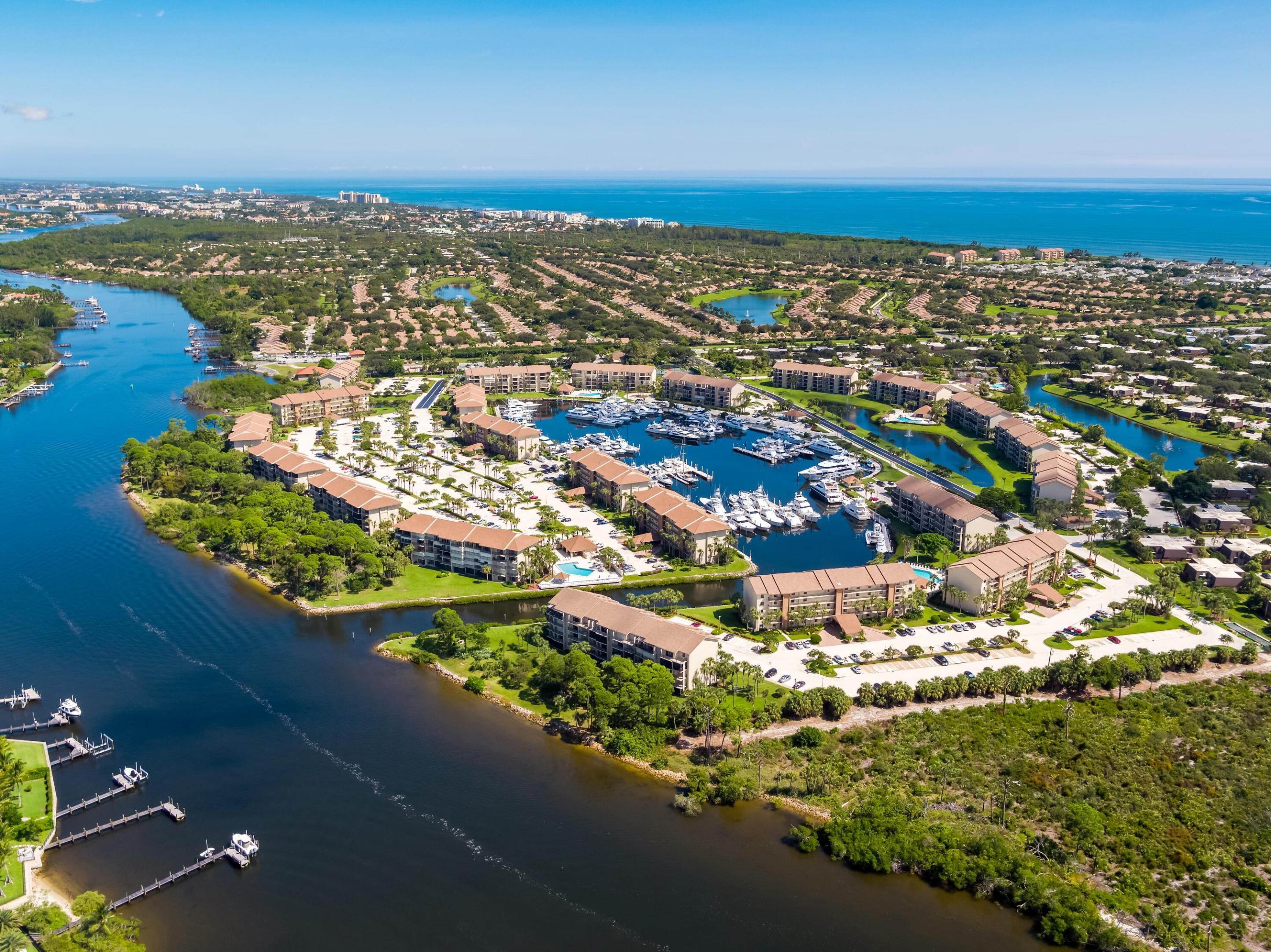Discover unparalleled waterfront living at this stunning new listing in Marina Bluffs, Jupiter, FL. Nestled along the serene Intracoastal Waterway, just one mile from Jupiter's glorious beaches, this residence offers the perfect blend of coastal elegance, boating convenience, and resort-style amenities in one of North Palm Beach County's most desirable communities. The 2 bedroom, 2 bath condo is offered fully furnished "turnkey" and boasts a private balcony overlooking the gorgeous Intracoastal. This community features many amenities including pools, tennis courts, lush grounds and don't forget to find "wine beach".  One mile away are Jupiter's glorious beaches which rank among Florida's finest: warm turquoise waters, wide sandy shores, and natural dunes create an idyllic  escape for swimming, snorkeling, surfing, or sunset walks. Imagine morning coffee on your balcony watching boats glide by, afternoons at the pool or beach, and evenings with breathtaking Intracoastal sunsets. #ComeJoinUs and #LoveWhereYouLive