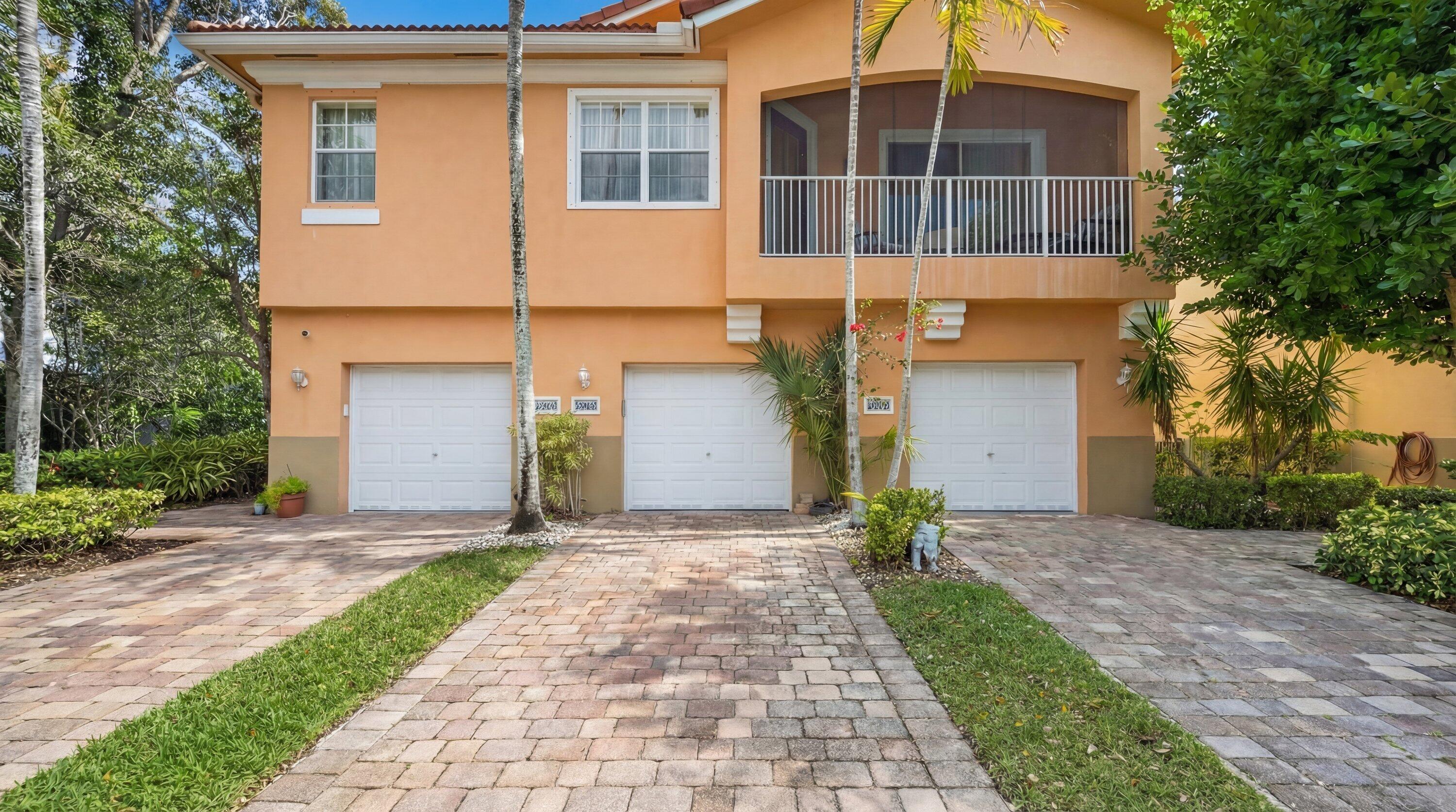 Seller is offering $7,000 towards Buyers closing costs!!   Welcome to this chic 2-bedroom, 2.5-bathroom townhouse with a one-car garage, located in a quiet gated community in a prime location. Just minutes from Northlake Blvd, the beautiful beaches of Singer Island, and less than 15 minutes to Palm Beach International Airport, this home offers both convenience and coastal living.  Upstairs, you'll find two spacious bedrooms, each with its own en-suite bathroom. The primary suite features a walk-in closet, dual vanity sinks, and a bathtub/shower combination for added comfort.  The home boasts new laminate flooring throughout and a bright, open-concept living, dining, and kitchen area. The kitchen includes a large island, beautiful wood cabinetry, and an oversized pantry closet. Sliding glass doors lead to a private, paved patio -- perfect for morning coffee or relaxing around a fire pit.  Additional highlights include: attached one-car garage, in-home washer and dryer for convenience, tile bathroom flooring, and a spacious/airy layout.  Residents enjoy access to a beautifully maintained community pool and clubhouse overlooking the lake. All ages are welcome, and up to two pets are allowed.  The low HOA fee of $390/month covers common areas, lawn care, sewer and trash, roof maintenance, pool service, exterior maintenance, and building insurance -- providing exceptional value and peace of mind.  Don't miss this opportunity to own an affordable, move-in-ready home in an unbeatable location!